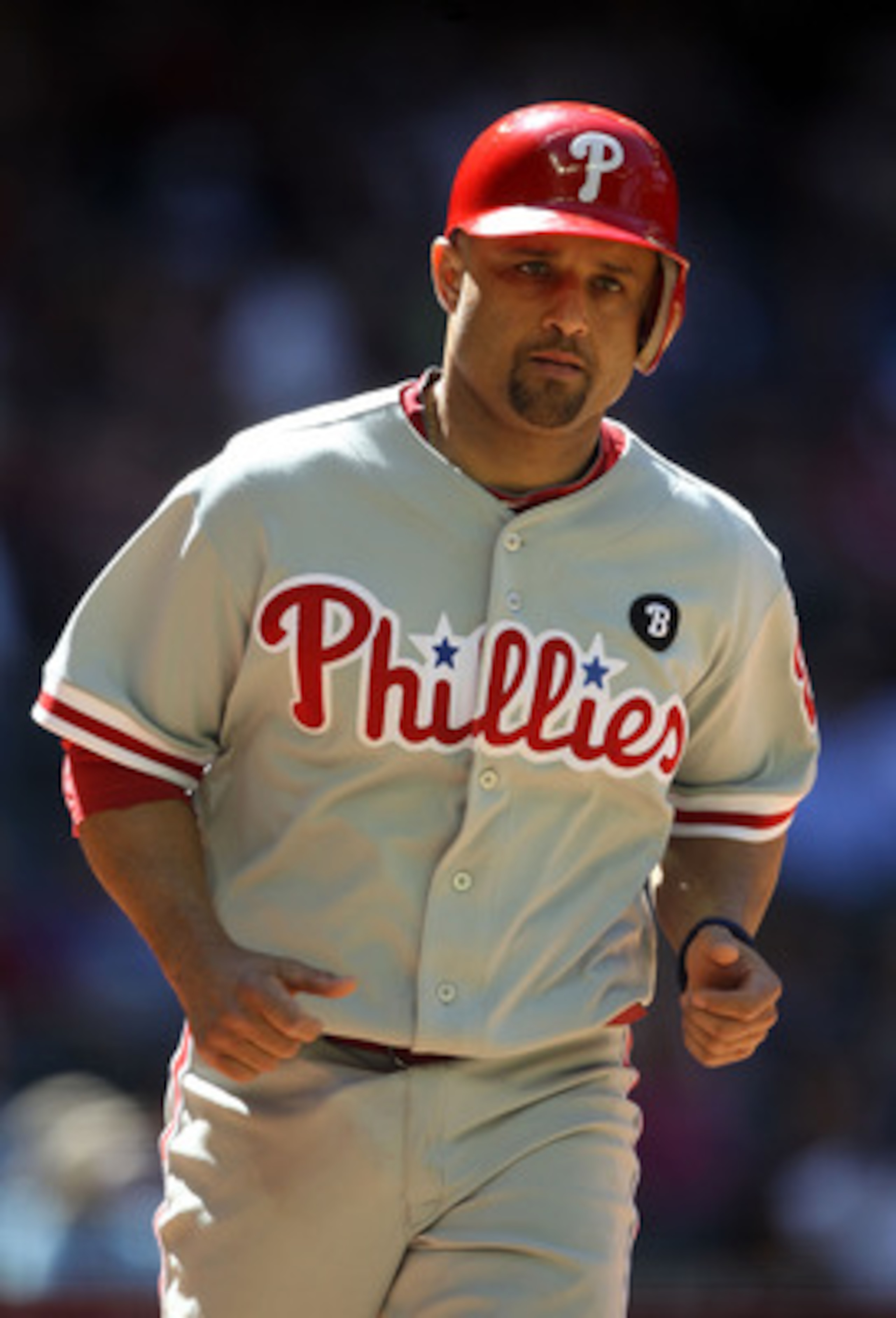 PHOENIX, AZ - APRIL 27:  Placido Polanco #27 of the Philadelphia Phillies scores a run against the Arizona Diamondbacks during the Major League Baseball game at Chase Field on April 27, 2011 in Phoenix, Arizona.  The Phillies defeated the Diamondbacks 8-4