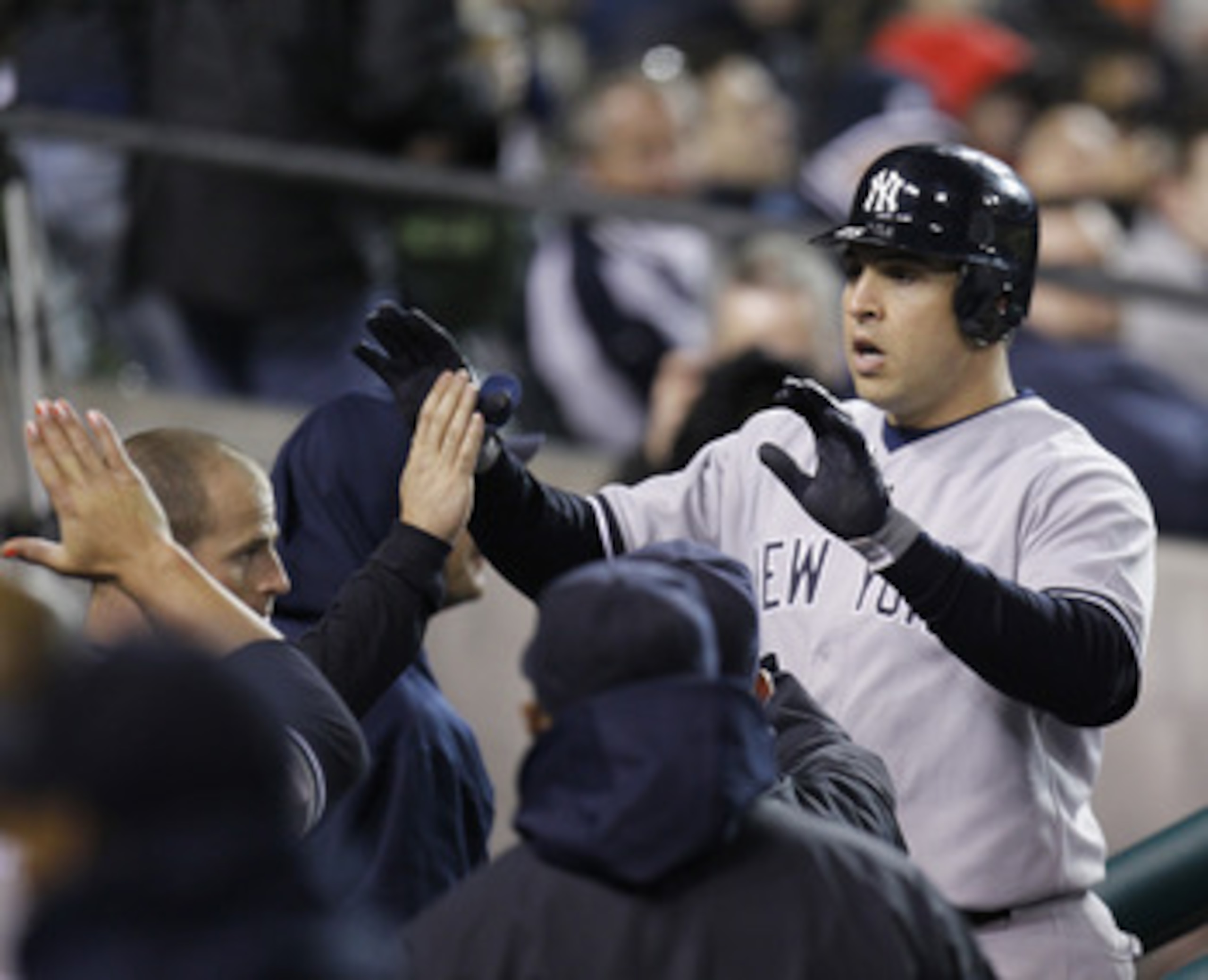 DETROIT, MI - MAY 03:  Mark Teixeira #25 of the New York Yankees celebrates a eighth inning home run while returning to the dugout while playing the Detroit Tigers at Comerica Park on May 3, 2011 in Detroit, Michigan. Detroit won the game 4-2. (Photo by G
