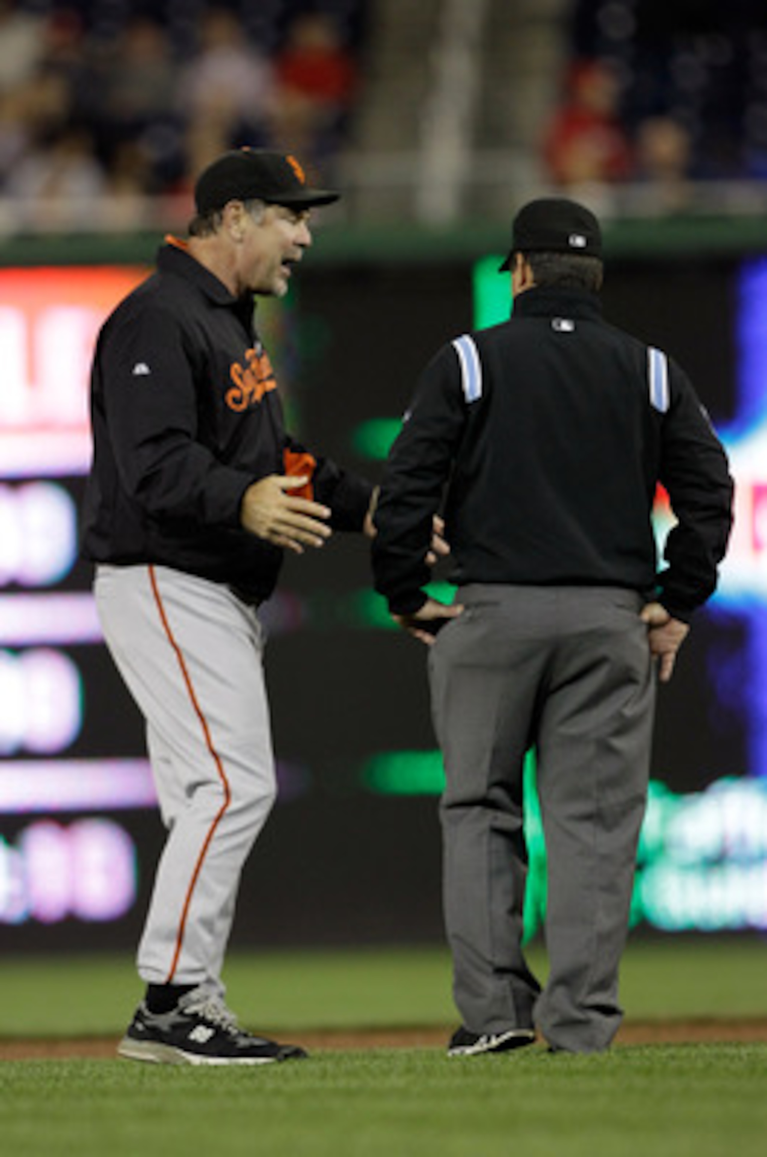 WASHINGTON, DC - APRIL 29: Manager Bruce Bochy #15 of the San Francisco Giants argues a call with second base umpire Rob Drake during the fifth inning against the Washington Nationals at Nationals Park on April 29, 2011 in Washington, DC.  (Photo by Rob C