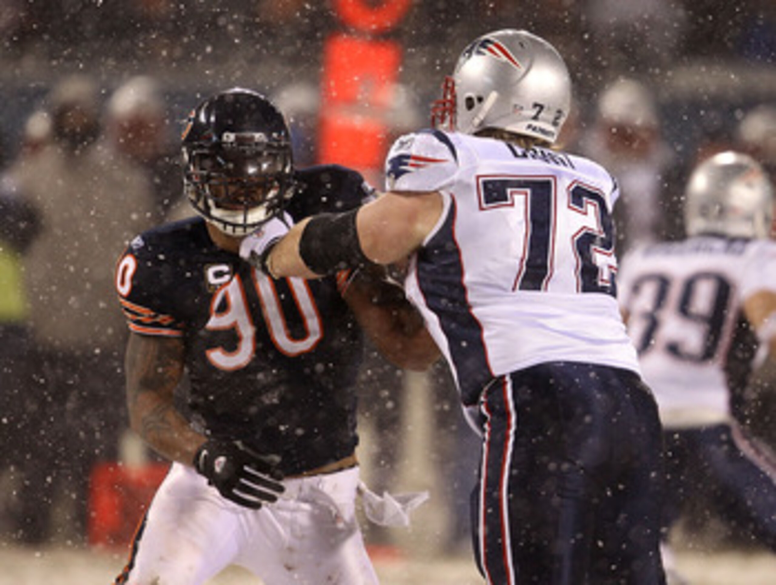 CHICAGO, IL - DECEMBER 12: Julius Peppers #90 of the Chicago Bears rushes against Matt Light #72 of the New England Patriots at Soldier Field on December 12, 2010 in Chicago, Illinois. The Patriots defeated the Bears 36-7. (Photo by Jonathan Daniel/Getty