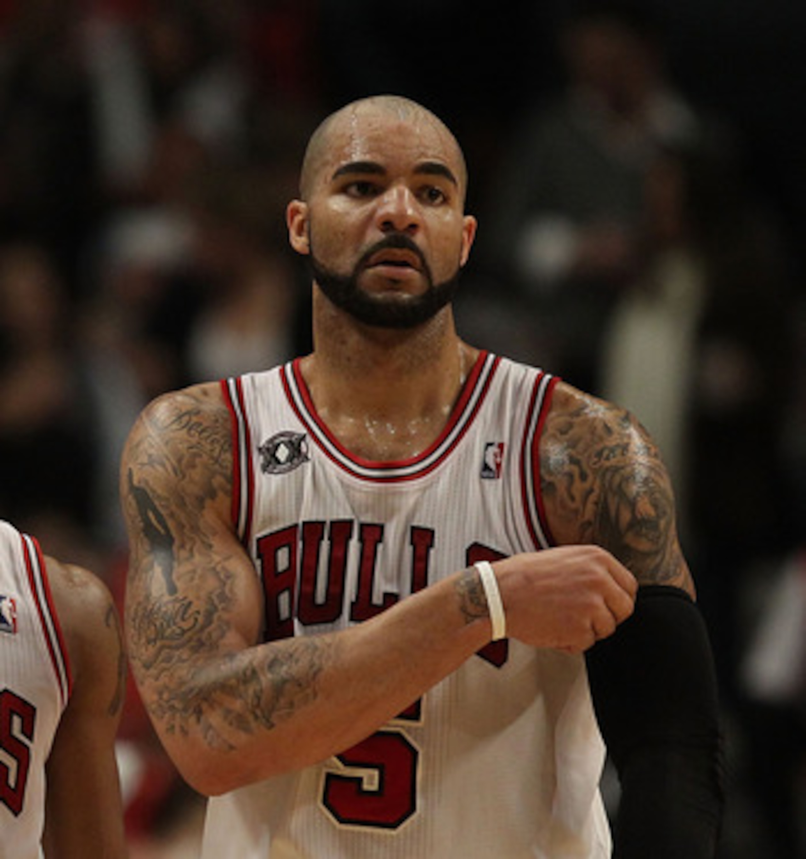 CHICAGO, IL - FEBRUARY 17: Derrick Rose #1 and Carlos Boozer #5 of the Chicago Bulls return to the court after a time-out against the San Antonio Spurs at the United Center on February 17, 2011 in Chicago, Illinois. The Bulls defeated the Spurs 109-99. NO