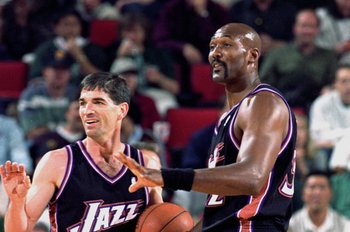3 May 2000:   John Stockton #12 and Karl Malone #32 of the Utah Jazz make a hand gesture to some teamates during the NBA Western Conference Playoffs Round One Game against the Seattle SuperSonics at Key Arena in Seattle, Washington. The SuperSonics defeat