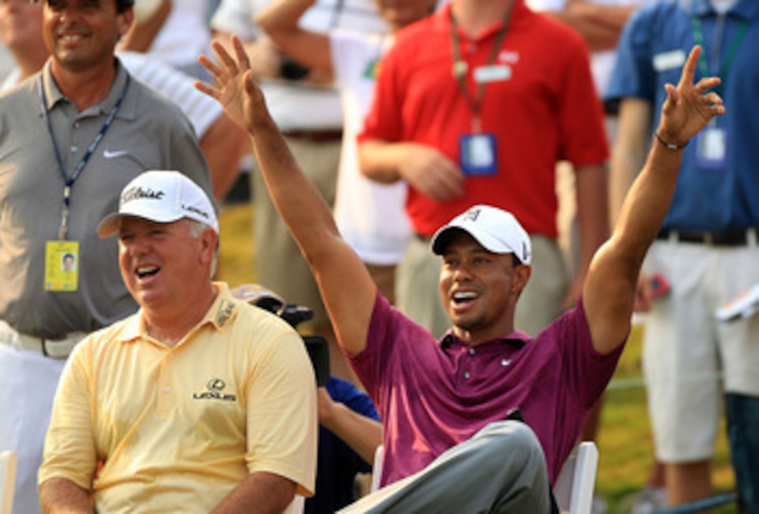 PONTE VEDRA BEACH, FL - MAY 11:  Tiger Woods (R) and Mark O'Meara (L) react to a shot by caddie Steve Williams (not pictured) for the 'Caddie Challenge' on the 17th hole during a practice round prior to the start of THE PLAYERS Championship held at THE PL