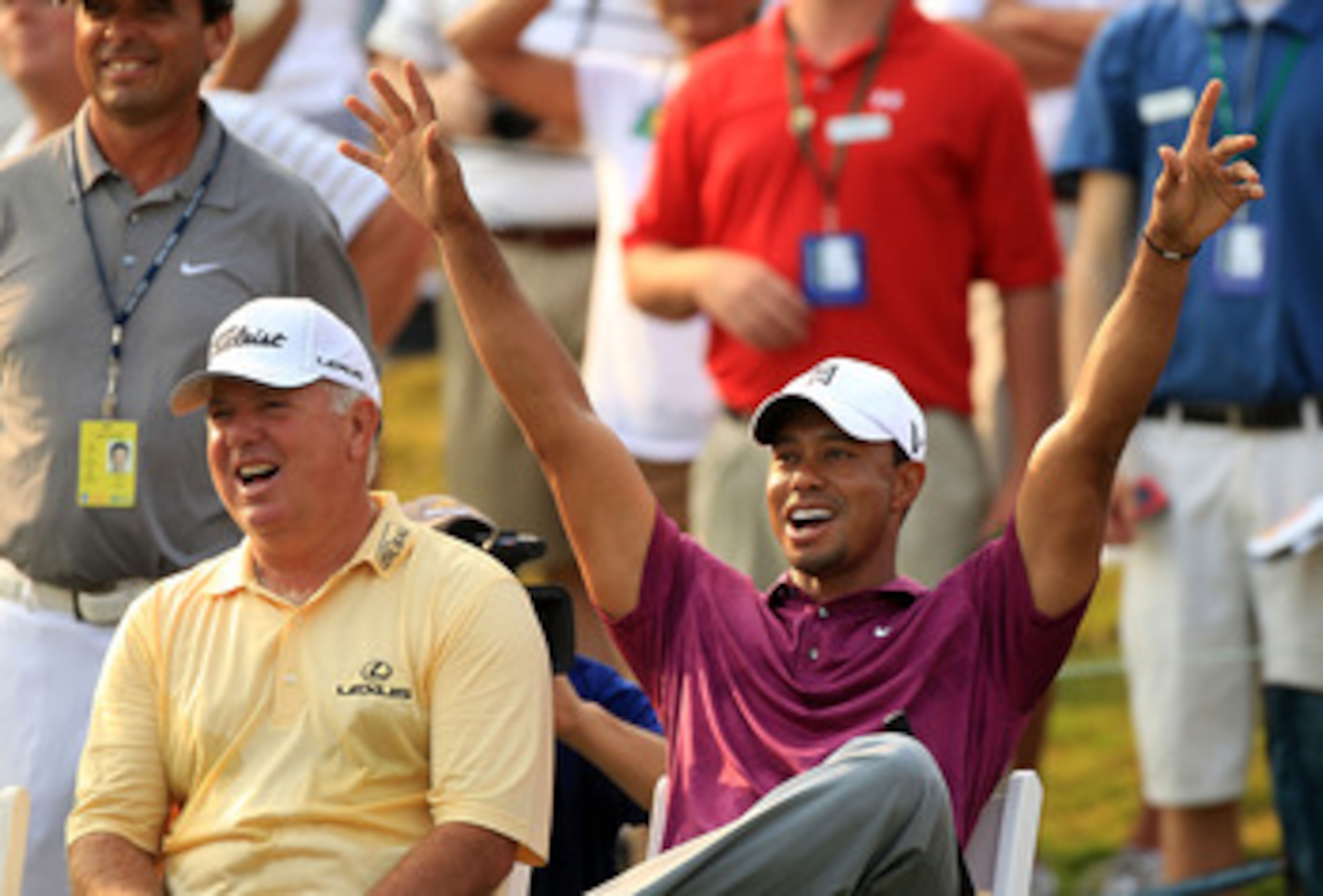 PONTE VEDRA BEACH, FL - MAY 11: Tiger Woods (R) and Mark O'Meara (L) react to a shot by caddie Steve Williams (not pictured) for the 'Caddie Challenge' on the 17th hole during a practice round prior to the start of THE PLAYERS Championship held at THE PL PONTE VEDRA BEACH, FL - MAY 11: Tiger Woods (R) and Mark O'Meara (L) react to a shot by caddie Steve Williams (not pictured) for the 'Caddie Challenge' on the 17th hole during a practice round prior to the start of THE PLAYERS Championship held at THE PL