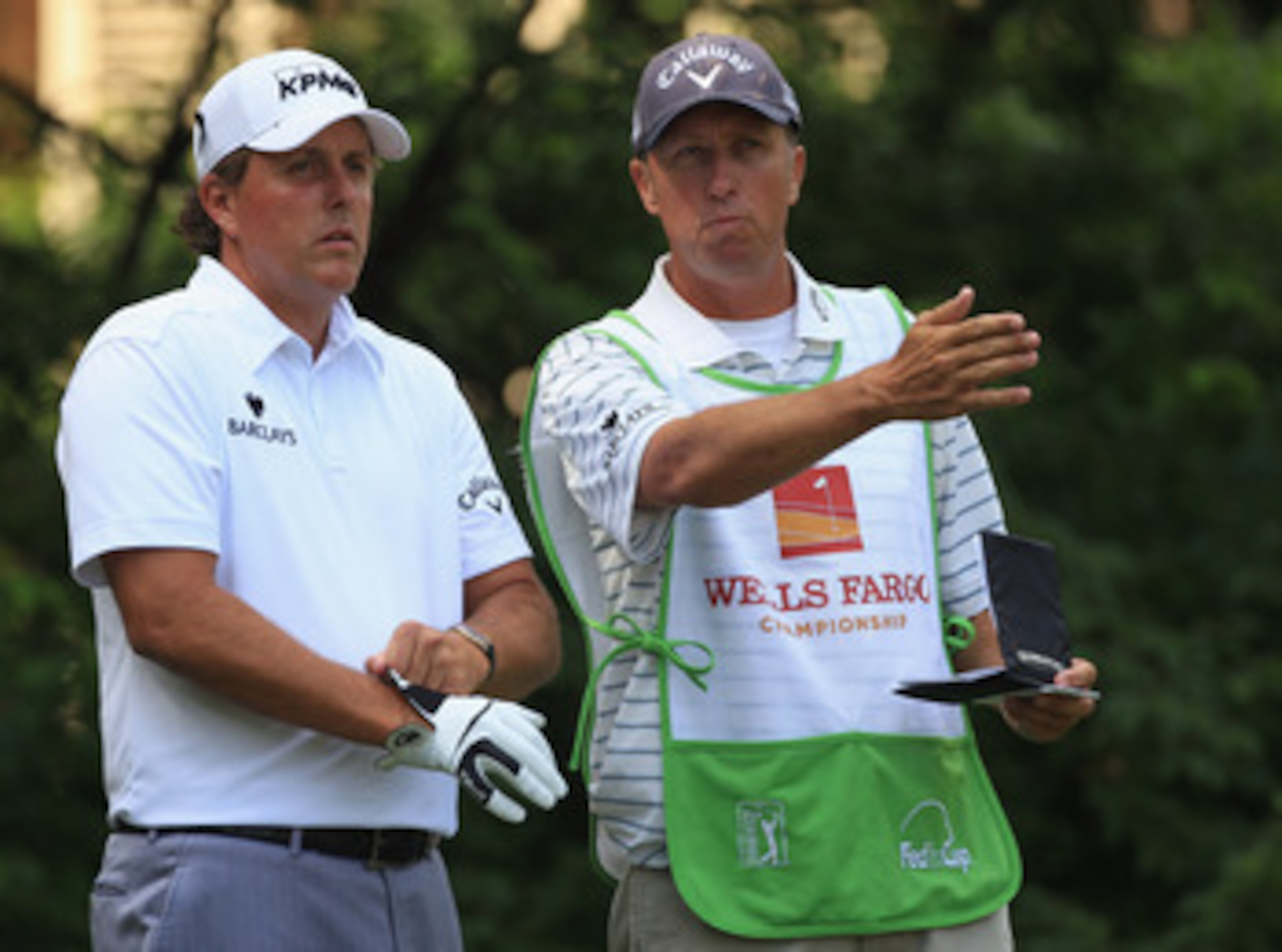 CHARLOTTE, NC - MAY 07: Phil Mickelson and his caddie Jim Mackay during the third round of the Wells Fargo Championship at Quail Hollow Club on May 7, 2011 in Charlotte, North Carolina. (Photo by Streeter Lecka/Getty Images) CHARLOTTE, NC - MAY 07: Phil Mickelson and his caddie Jim Mackay during the third round of the Wells Fargo Championship at Quail Hollow Club on May 7, 2011 in Charlotte, North Carolina. (Photo by Streeter Lecka/Getty Images)