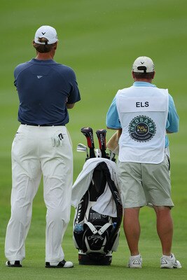 SUN CITY, SOUTH AFRICA - DECEMBER 02:  Ernie Els of South Africa stand with his caddie Ricci Roberts during the first round of the 2010 Nedbank Golf Challenge at the Gary Player Country Club Course  on December 2, 2010 in Sun City, South Africa.  (Photo b