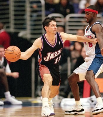 8 Nov 2000:  John Stockton #12 of the Utah Jazz passes the ball away from Jeff McInnis #5 of the Los Angeles Clippers during the game at the Staples Center in Los Angeles, California.  The Jazz defeated the Clippers 93-87. NOTE TO USER: It is expressly un