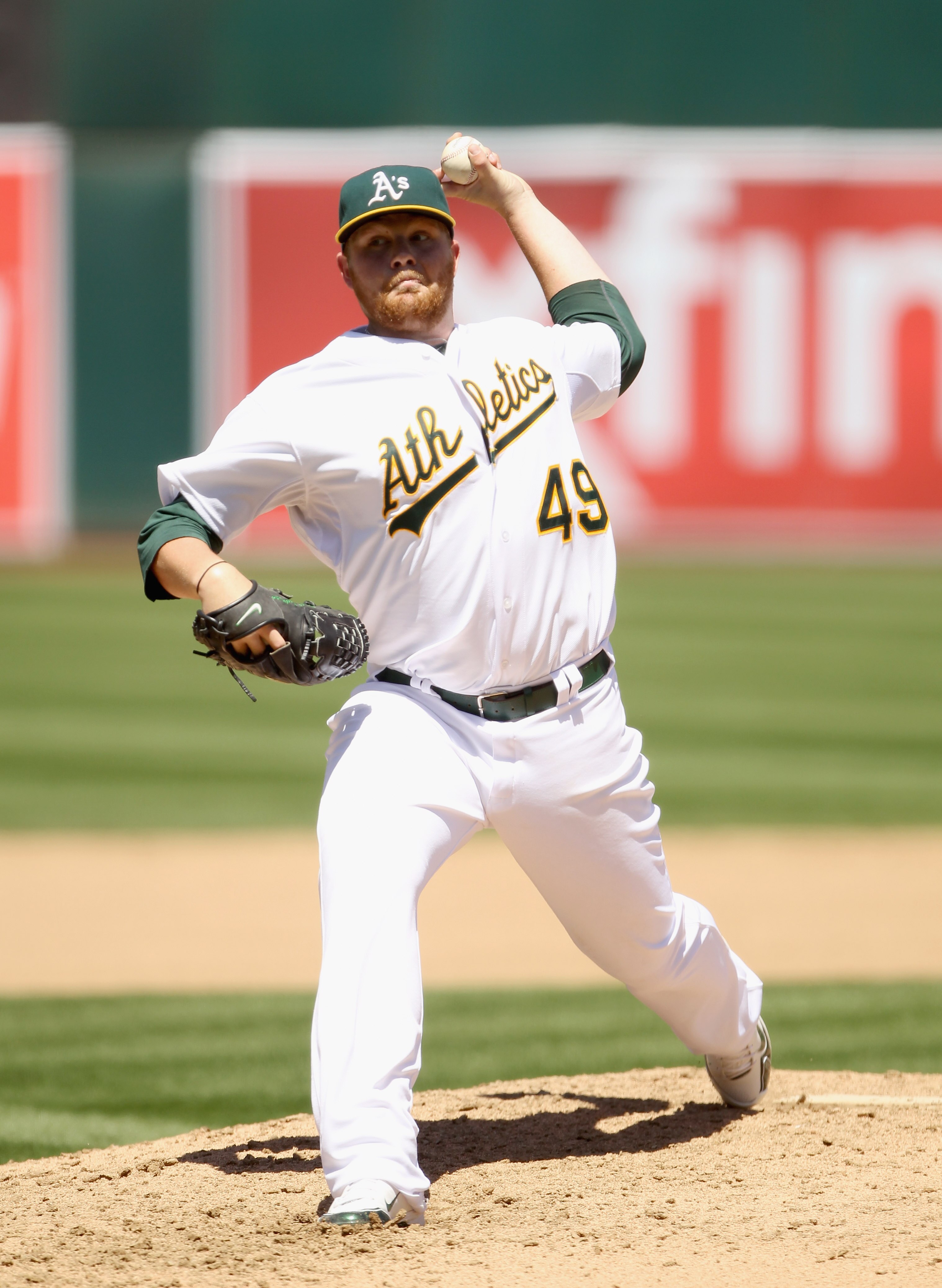 OAKLAND, CA - APRIL 30:  Brett Anderson #49 of the Oakland Athletics pitches against the Texas Rangers at Oakland-Alameda County Coliseum on April 30, 2011 in Oakland, California.  (Photo by Ezra Shaw/Getty Images)