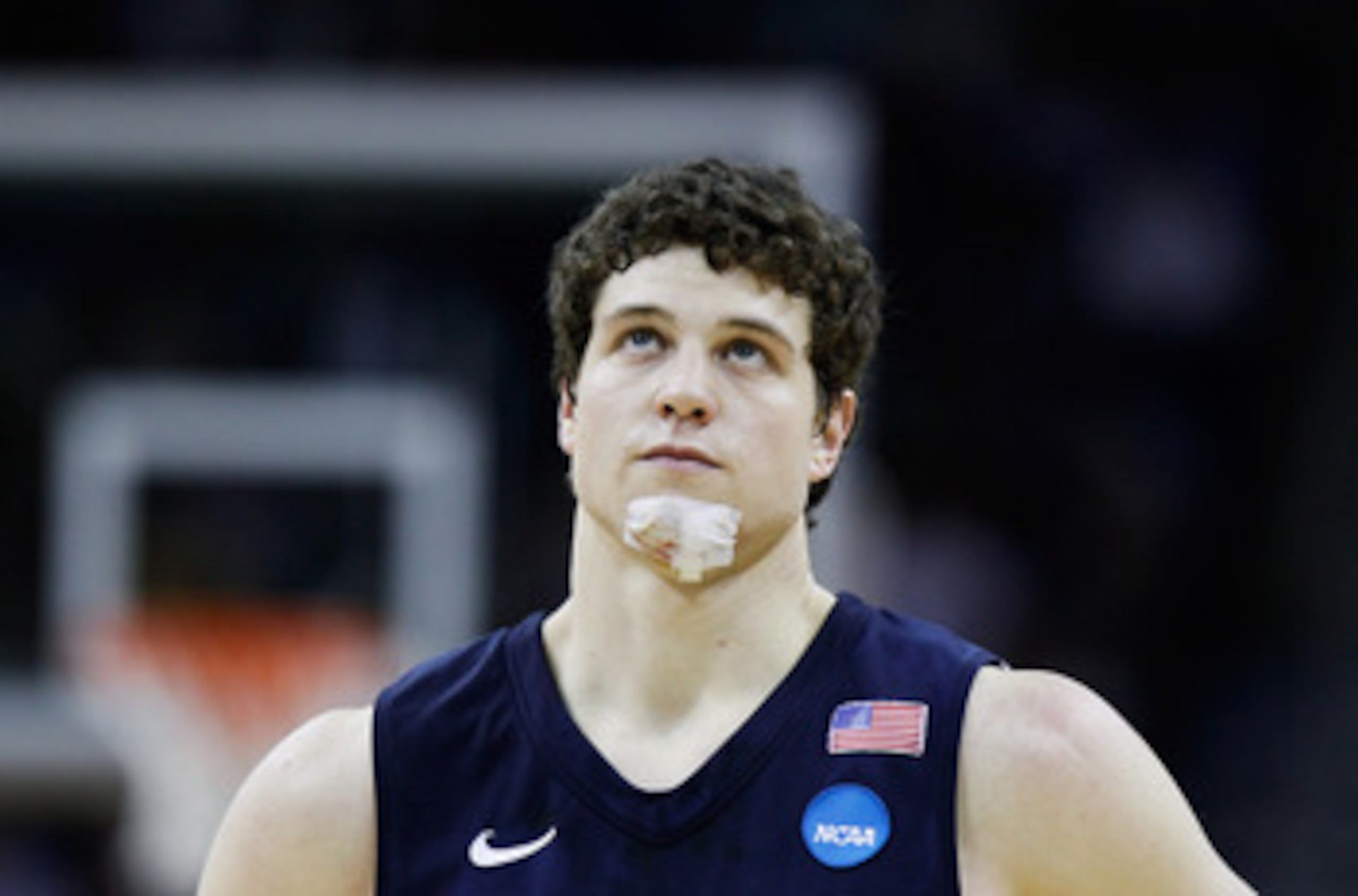 NEW ORLEANS, LA - MARCH 24:  Jimmer Fredette #32 of the Brigham Young Cougars looks on with a bandage on his chin during the second half against the Florida Gators during the Southeast regional of the 2011 NCAA men's basketball tournament at New Orleans A