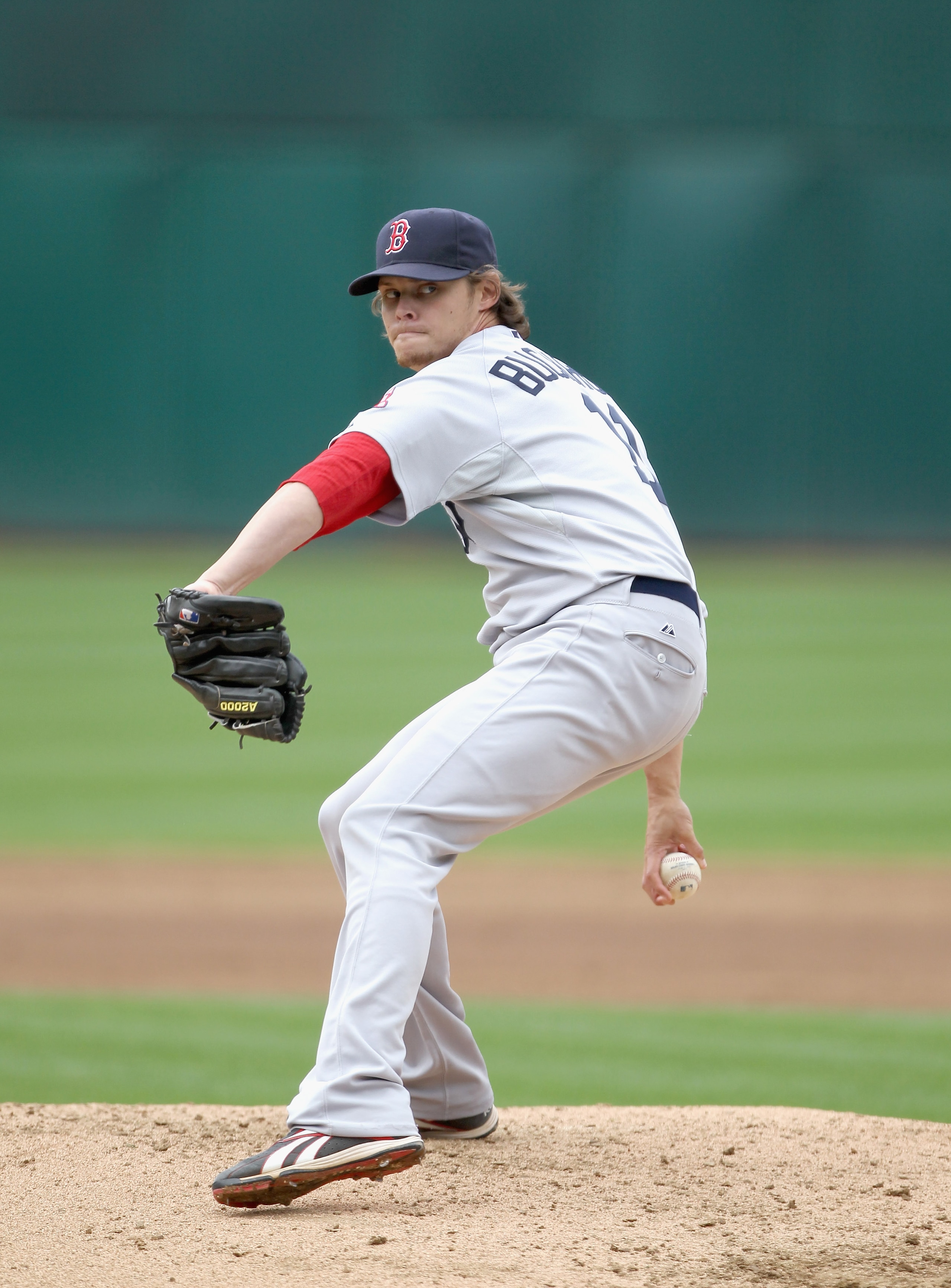 OAKLAND, CA - APRIL 20:  Clay Buchholz #11 of the Boston Red Sox in action against the Oakland Athletics at Oakland-Alameda County Coliseum on April 20, 2011 in Oakland, California.  (Photo by Ezra Shaw/Getty Images)