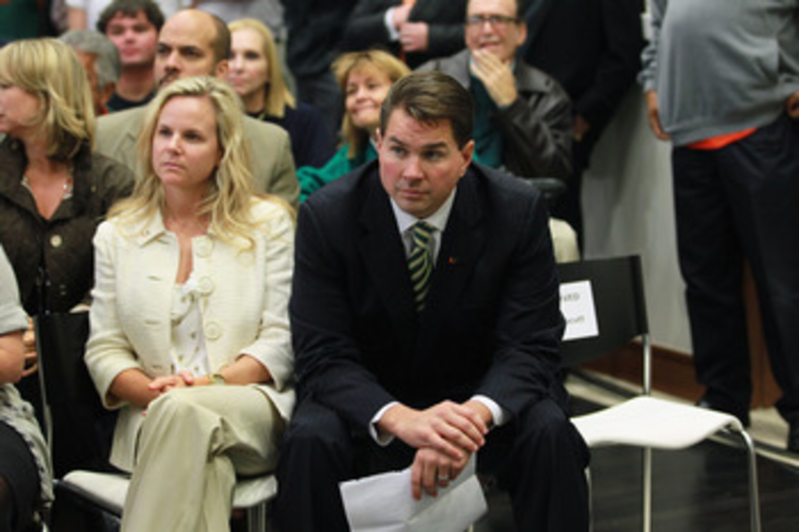 CORAL GABLES, FL - DECEMBER 13:  Former Temple University football coach Al Golden, 41, sits with his wife Kelly Golden before being introduced as the new head coach at the University of Miami  on December 13, 2010 in Coral Gables, Florida.  Golden is rep