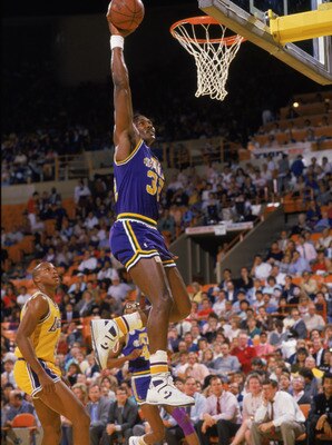 SALT LAKE CITY - 1988:  Karl Malone #32 of the Utah Jazz dunks the ball during an NBA game at The Salt Palace in Salt Lake City, Utah in 1988. (Photo by Stephen Dunn/Getty Images)