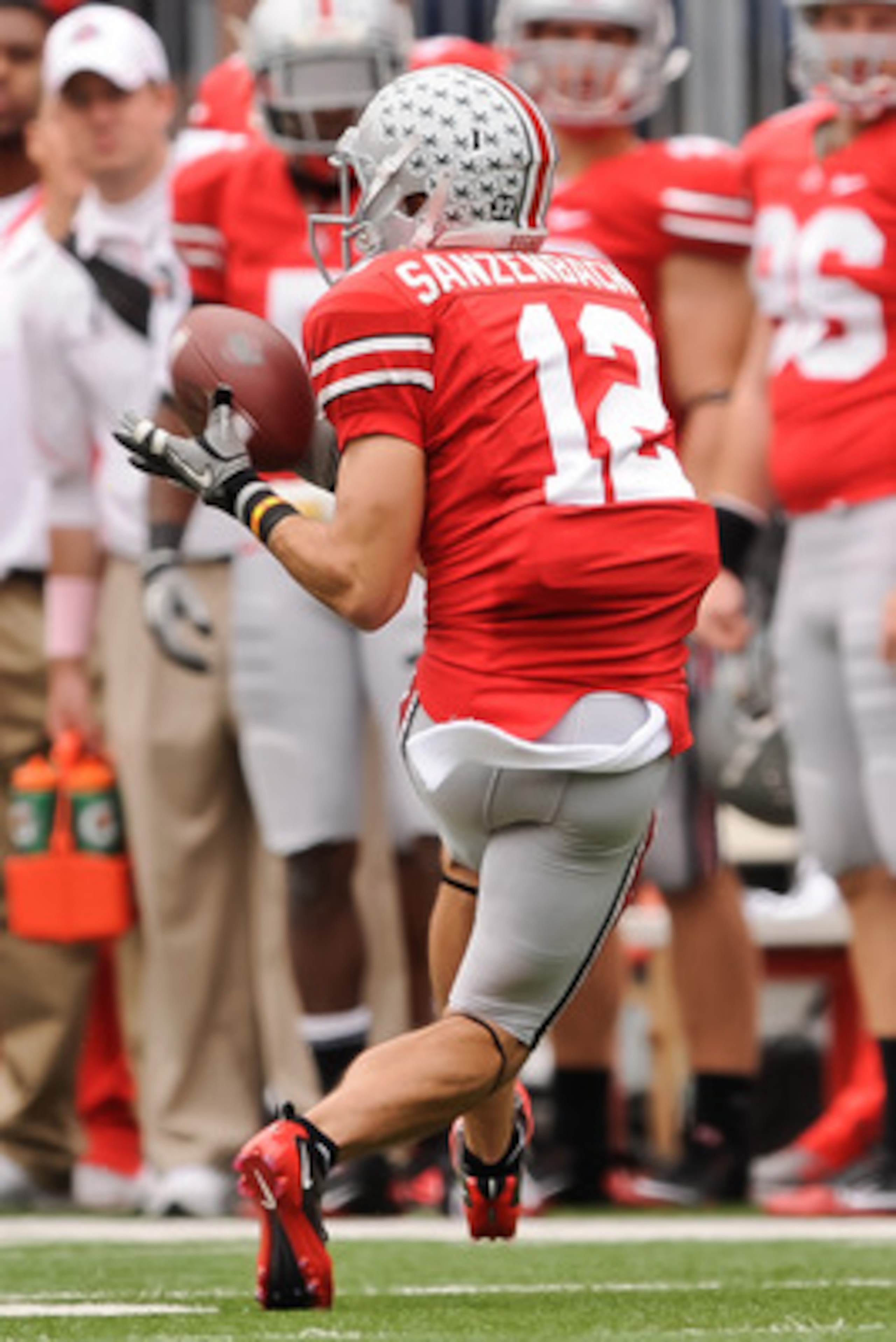COLUMBUS, OH - OCTOBER 23:  Dane Sanzenbacher #12 of the Ohio State Buckeyes makes a reception against the Purdue Boilermakers at Ohio Stadium on October 23, 2010 in Columbus, Ohio.  (Photo by Jamie Sabau/Getty Images)