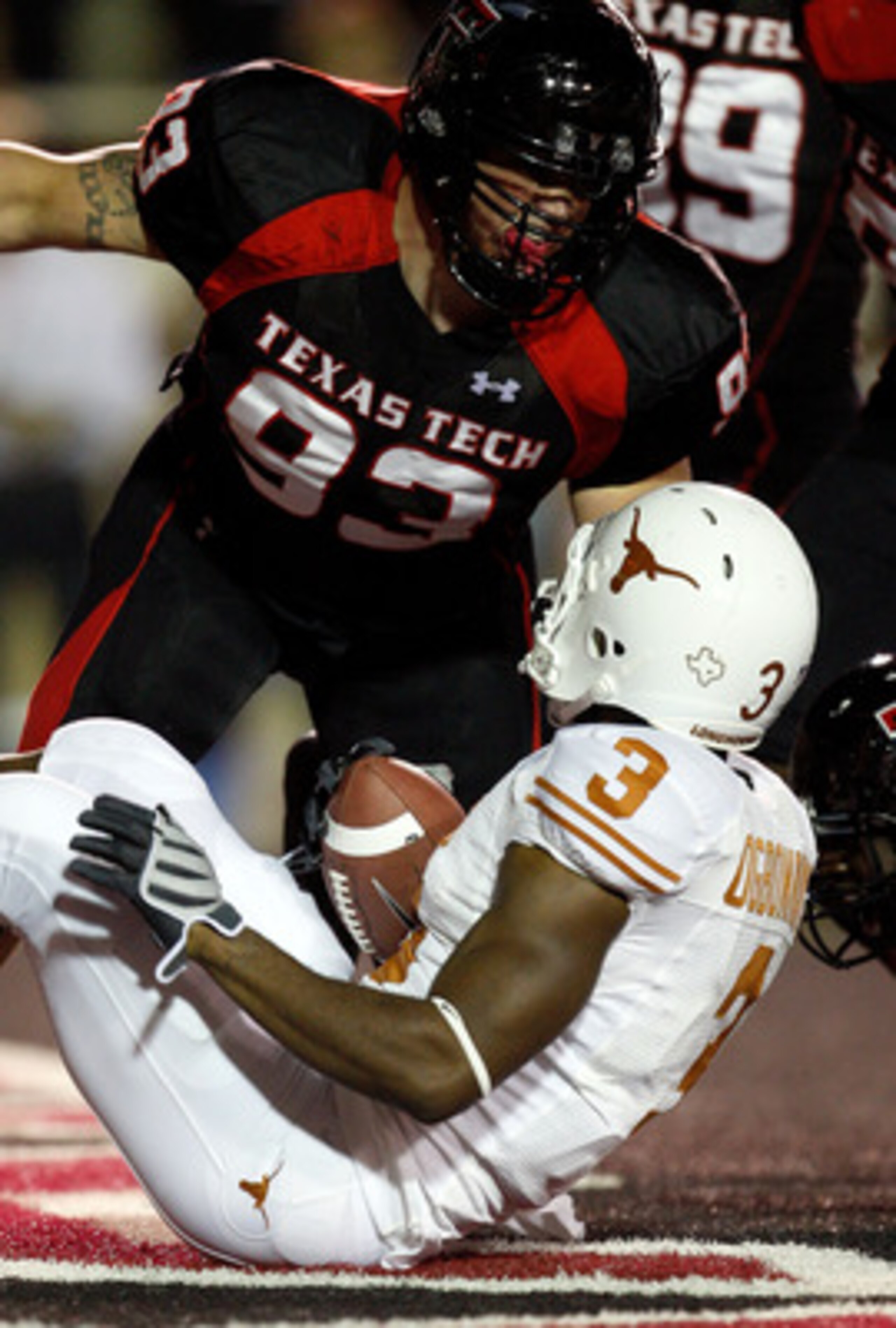 LUBBOCK, TX - NOVEMBER 01:  Colby Whitlock #93 of the Texas Tech Red Raiders tackles Chris Ogbonnaya #3 of the Texas Longhorns in the Longhorns endzone for a safety during the first half of the game on November 1, 2008 at Jones Stadium in Lubbock, Texas. 