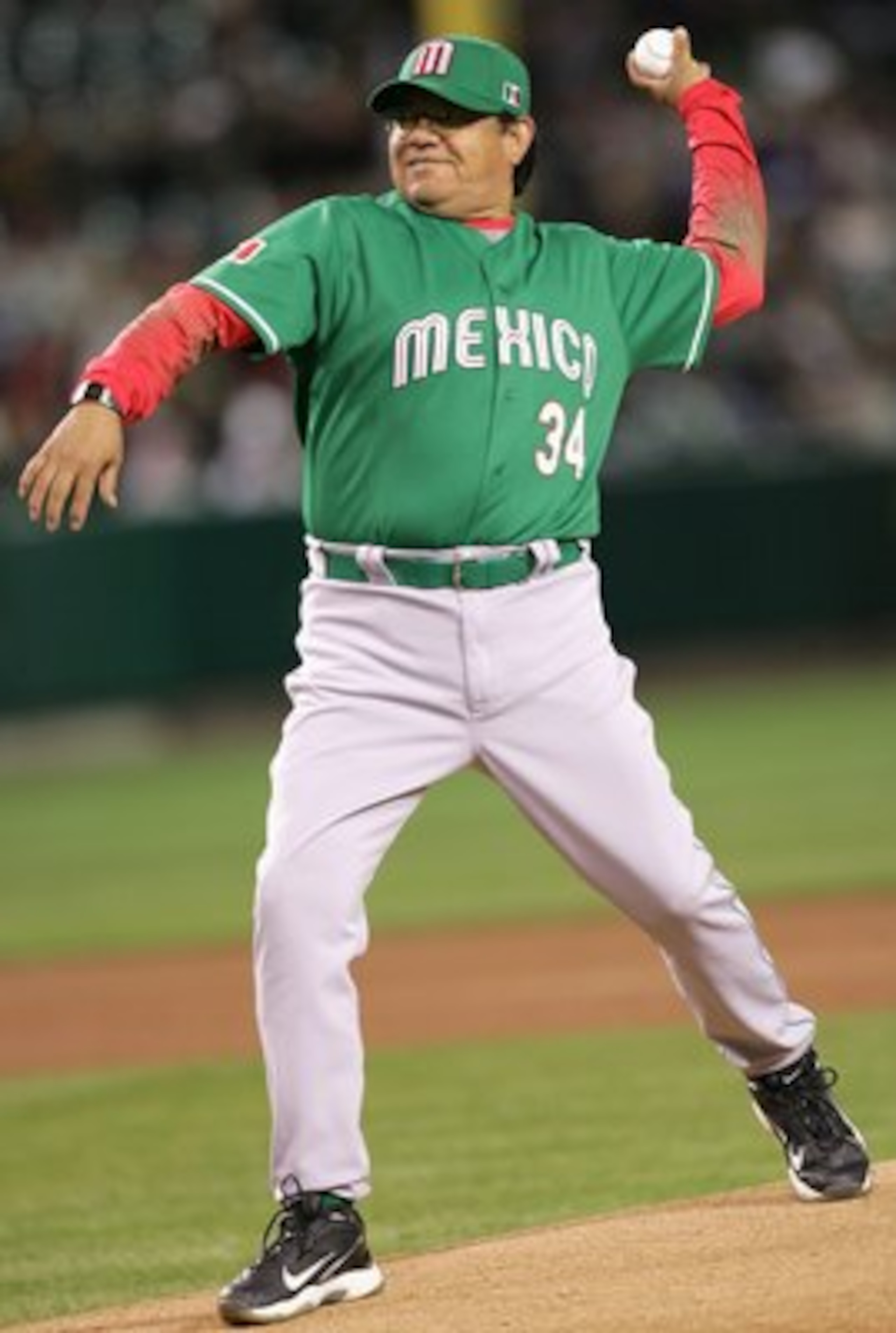 ANAHEIM, CA - MARCH 12:  Fernando Valenzuela #34 of Team Mexico throws out the first pitch before the Round 2 Pool 2 Game of the World Baseball Classic against Team Korea at Angel Stadium on March 12, 2006 in Anaheim, California.  (Photo by Stephen Dunn/G