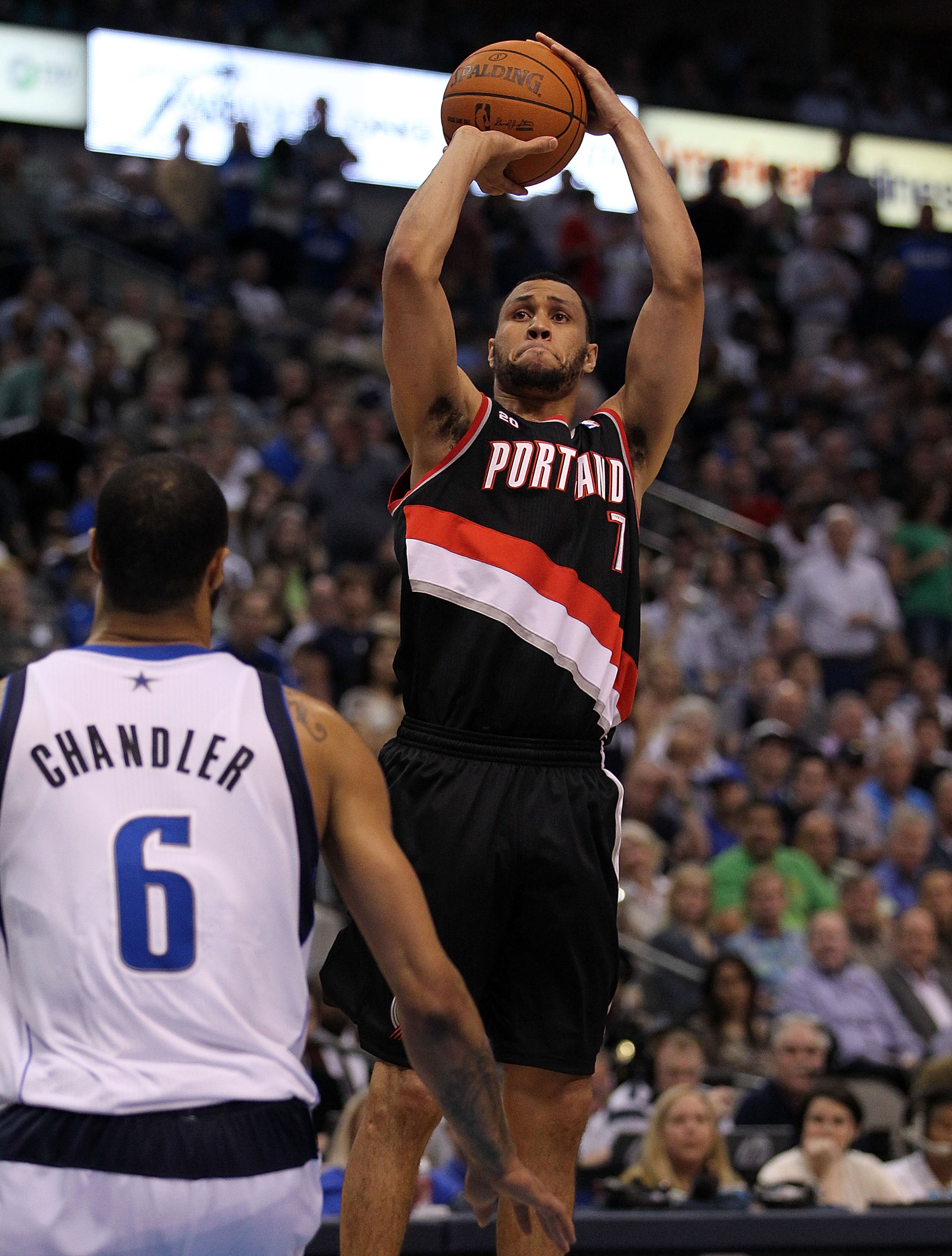 DALLAS, TX - APRIL 25:  Guard Brandon Roy #7 of the Portland Trail Blazers takes a shot against Tyson Chandler #6 of the Dallas Mavericks in Game Five of the Western Conference Quarterfinals during the 2011 NBA Playoffs on April 25, 2011 at American Airli