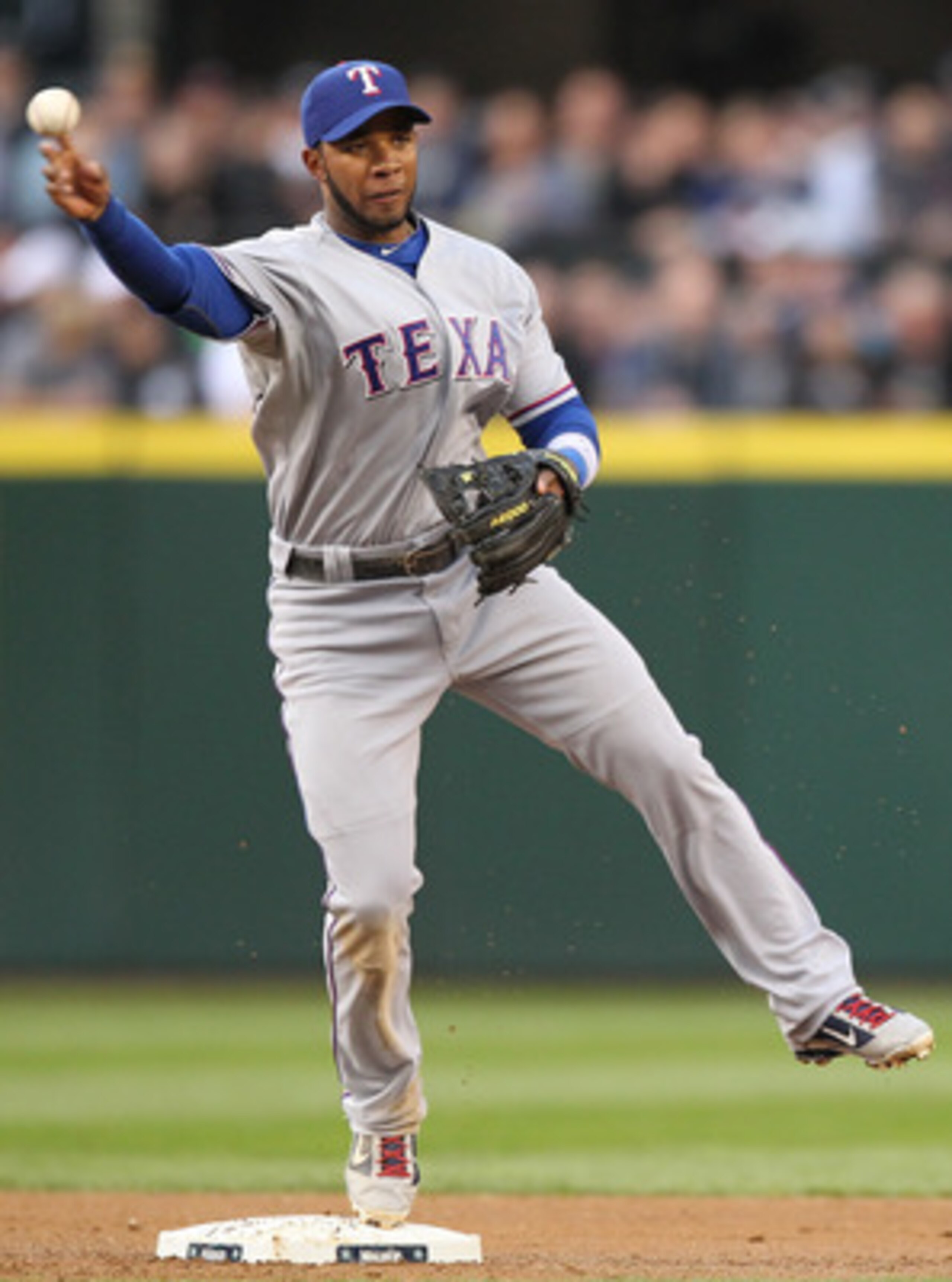 SEATTLE - MAY 04:  Elvis Andrus #1 of the Texas Rangers turns a double play against the Seattle Mariners at Safeco Field on May 4, 2011 in Seattle, Washington. (Photo by Otto Greule Jr/Getty Images)