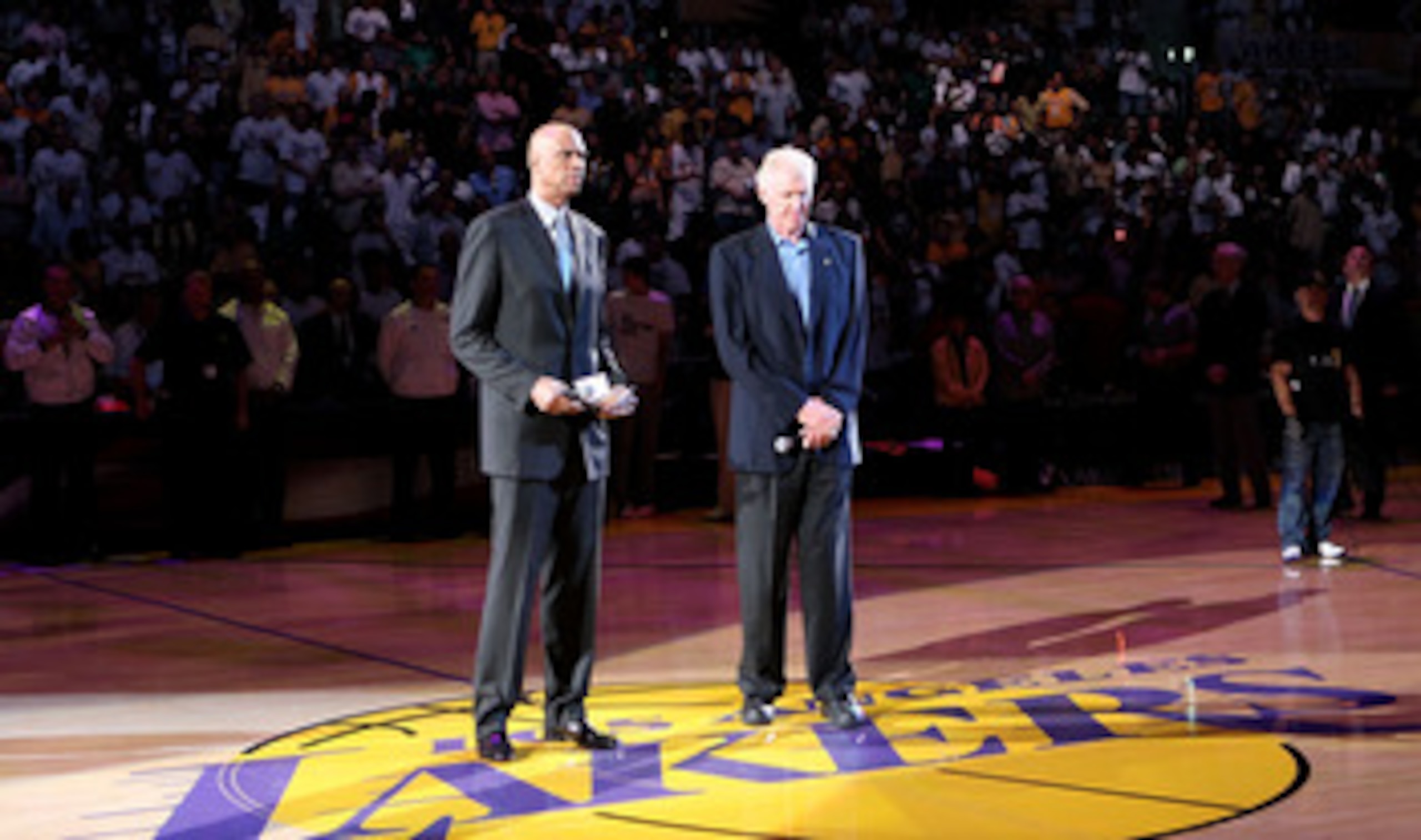 LOS ANGELES, CA - JUNE 06:  NBA legends Kareem Abdul-Jabbar and Bill Walton pause for a moment of silence to honor former UCLA head basketball coach John Wooden who passed away before Game Two of the 2010 NBA Finals betwen the Boston Celtics and the Los A