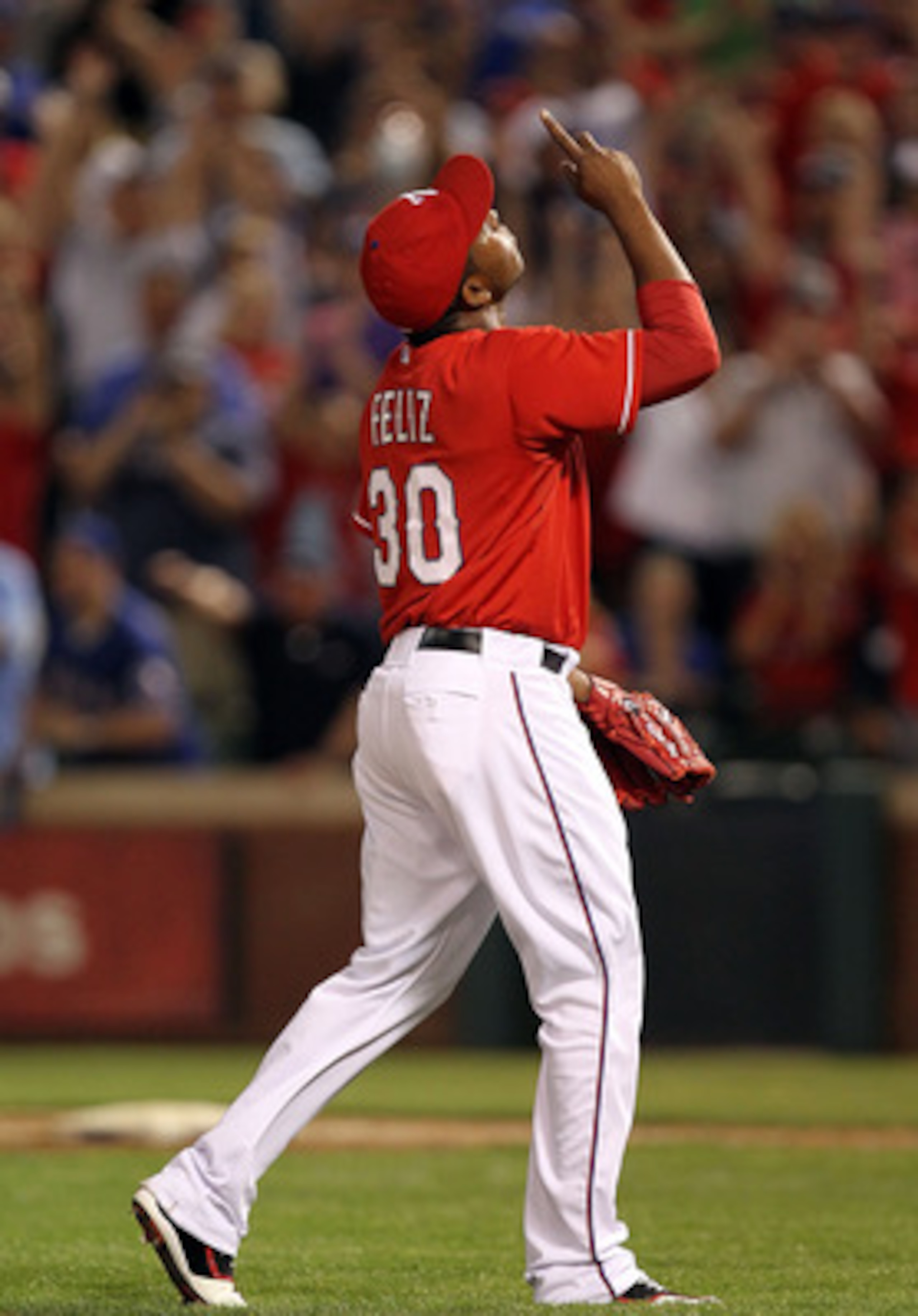 ARLINGTON, TX - MAY 07:  Pitcher Neftali Feliz #30 of the Texas Rangers reacts after a 7-5 win against the New York Yankees at Rangers Ballpark in Arlington on May 7, 2011 in Arlington, Texas.  (Photo by Ronald Martinez/Getty Images)