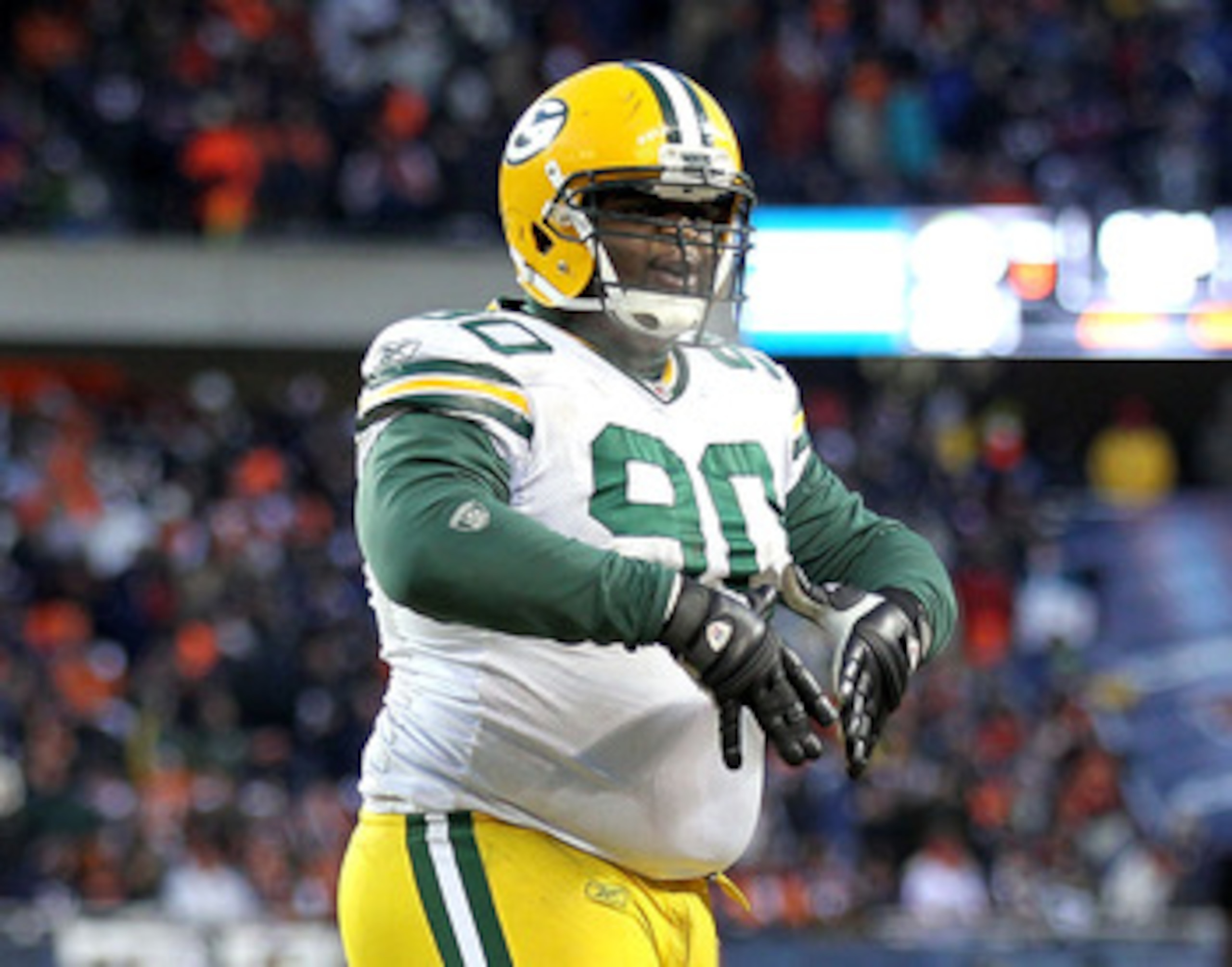 CHICAGO, IL - JANUARY 23:  B.J. Raji #90 of the Green Bay Packers reacts after scoring on a 18-yard interception return for a touchdown in the fourth quarter against the Chicago Bears in the NFC Championship Game at Soldier Field on January 23, 2011 in Ch