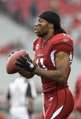 GLENDALE, AZ - DECEMBER 12:  Wide receiver Larry Fitzgerald #11 of the Arizona Cardinals warms up before the NFL game against the Denver Broncos at the University of Phoenix Stadium on December 12, 2010 in Glendale, Arizona. The Cardinals defeated the Bro