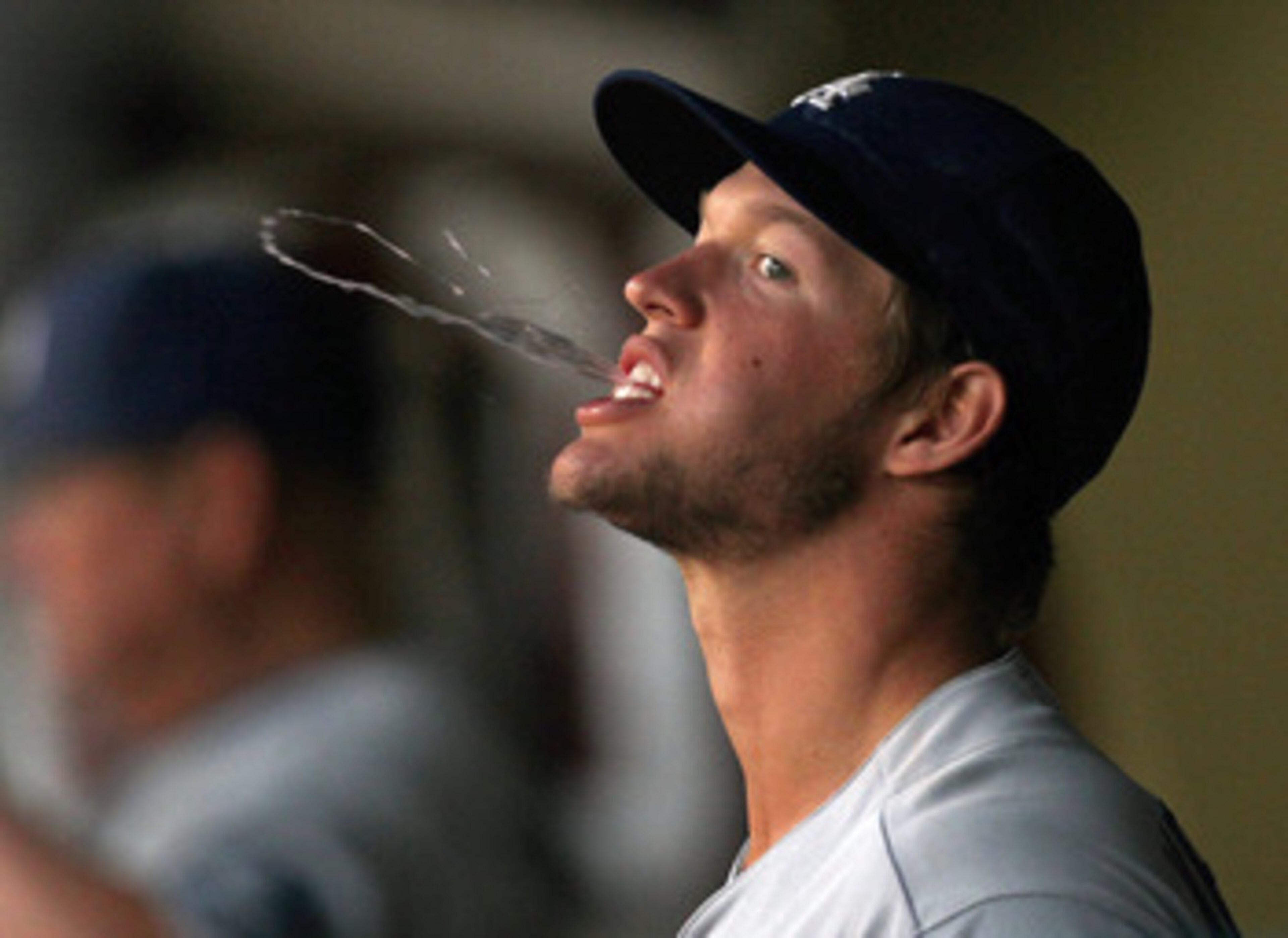 MIAMI GARDENS, FL - APRIL 25: Clayton Kershaw #22 of the Los Angeles Dodgers spits in the dugout during a game against the Florida Marlins at Sun Life Stadium on April 25, 2011 in Miami Gardens, Florida. (Photo by Mike Ehrmann/Getty Images) MIAMI GARDENS, FL - APRIL 25: Clayton Kershaw #22 of the Los Angeles Dodgers spits in the dugout during a game against the Florida Marlins at Sun Life Stadium on April 25, 2011 in Miami Gardens, Florida. (Photo by Mike Ehrmann/Getty Images)