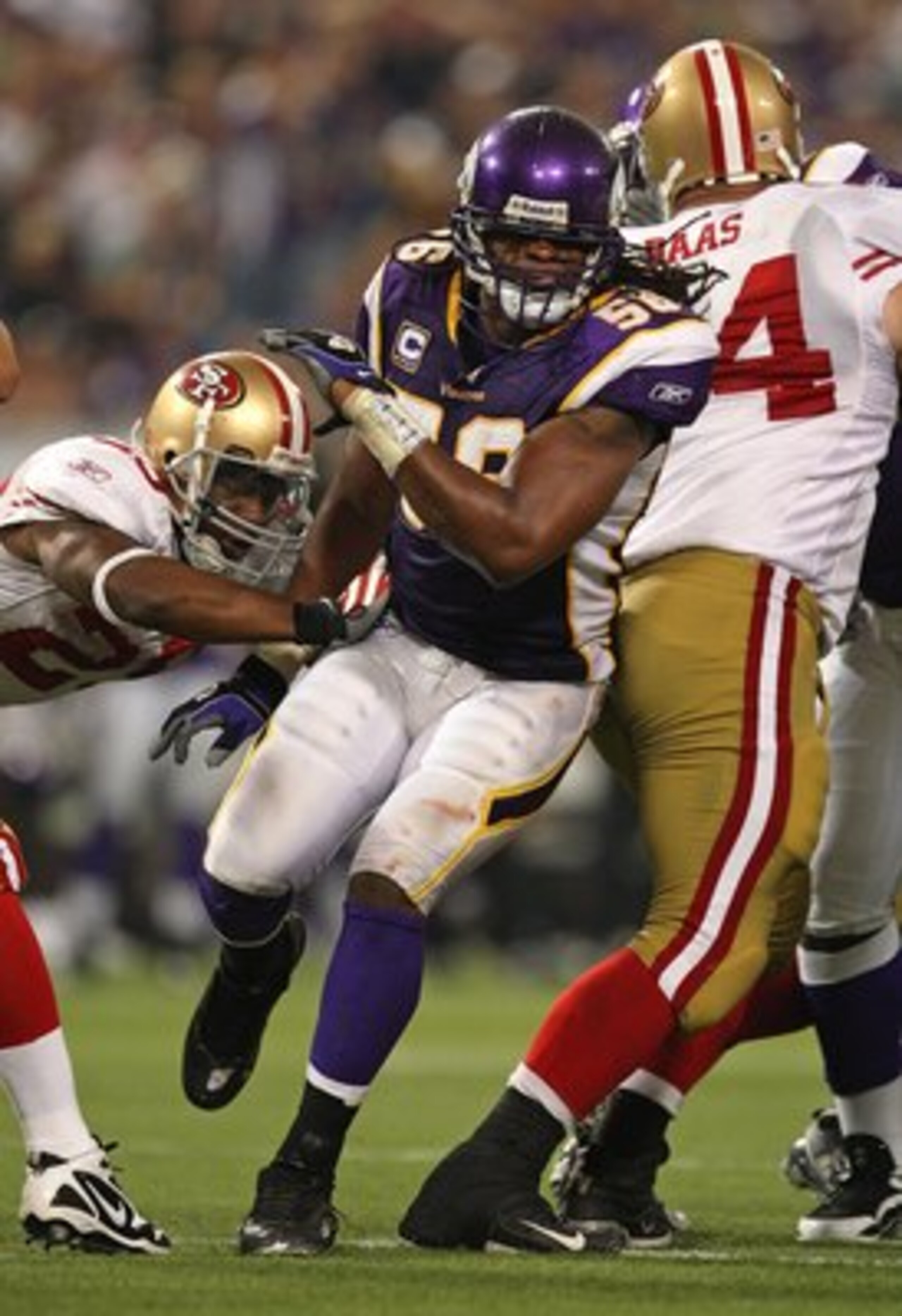 MINNEAPOLIS - SEPTEMBER 27: E.J.  Henderson #56 of the Minnesota Vikings rushes past a block attempt against the San Francisco 49ers at the Hubert H. Humphrey Metrodome on September 27, 2009 in Minneapolis, Minnesota. The Vikings defeated the 49ers 27-24.
