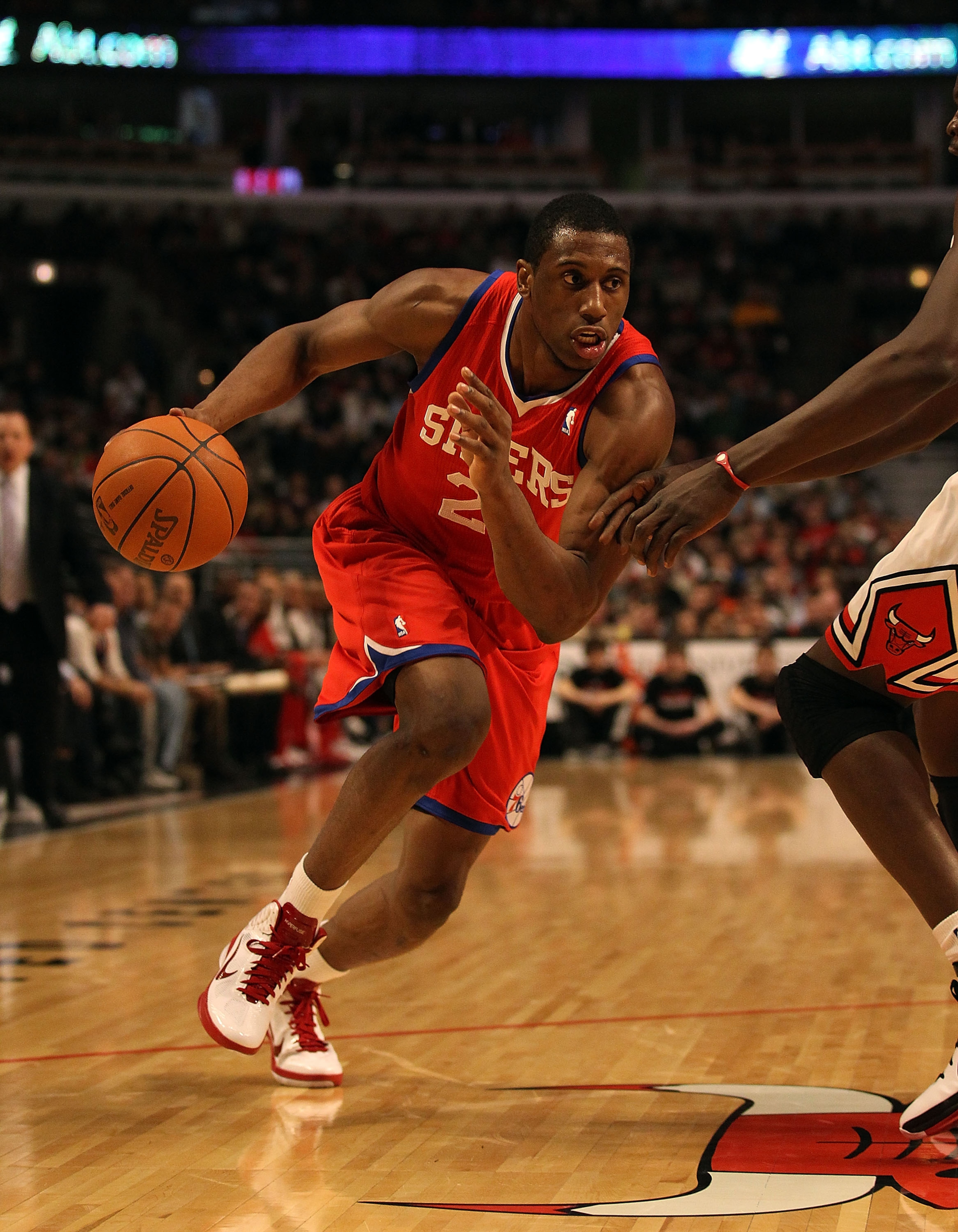 CHICAGO, IL - DECEMBER 21: Thaddeus Young #21 of the Philadelphia 76ers drives to the basket against the Chicago Bulls at the United Center on December 21, 2010 in Chicago, Illinois. The Bulls defeated the 76ers 121-76. NOTE TO USER: User expressly acknow