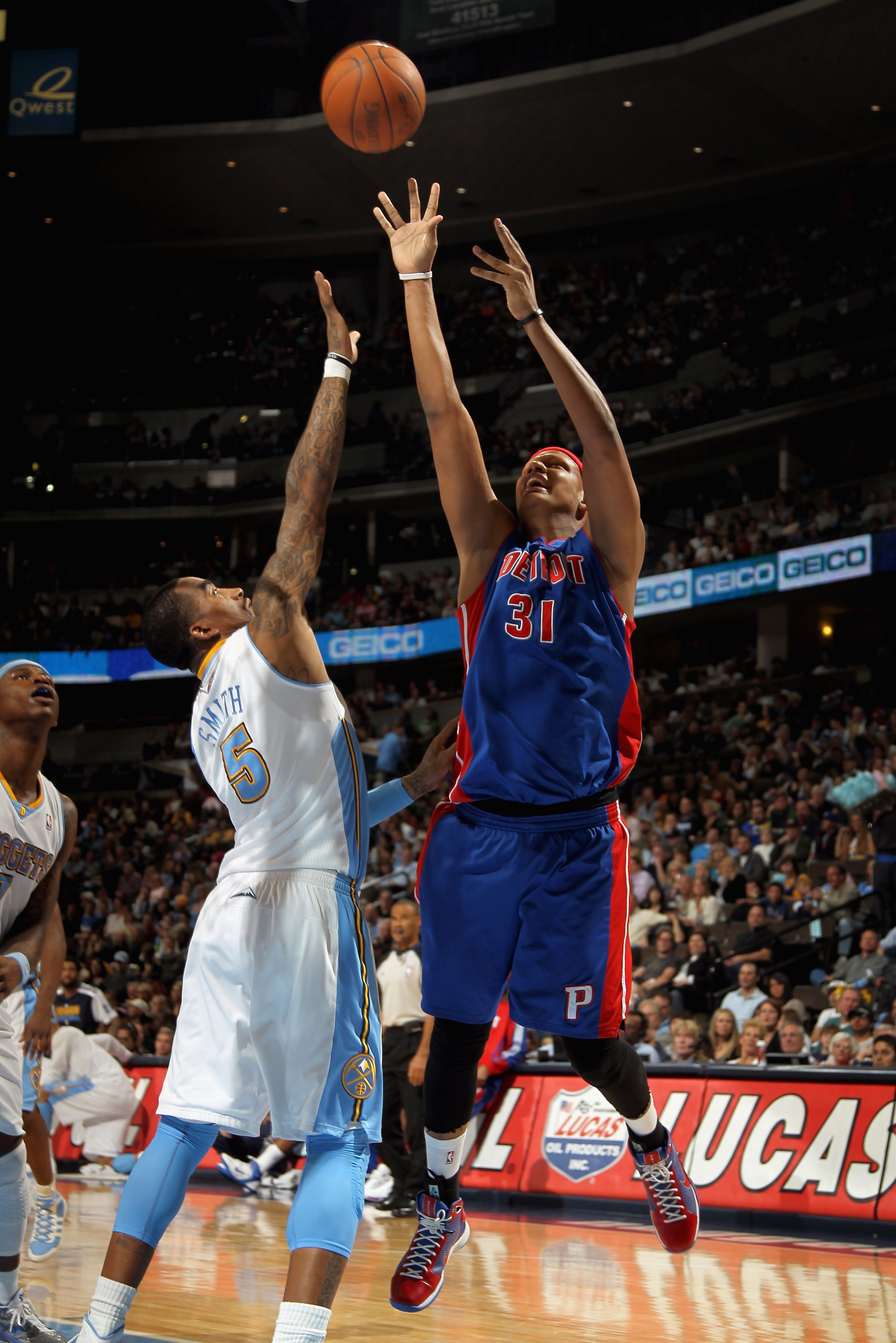 DENVER, CO - MARCH 12:  Charlie Villanueva #31 of the Detroit Pistons takes a shot over J.R. Smith #5 of the Denver Nuggets at the Pepsi Center on March 12, 2011 in Denver, Colorado. The Nuggets defeated the Pistons 131-101.  NOTE TO USER: User expressly