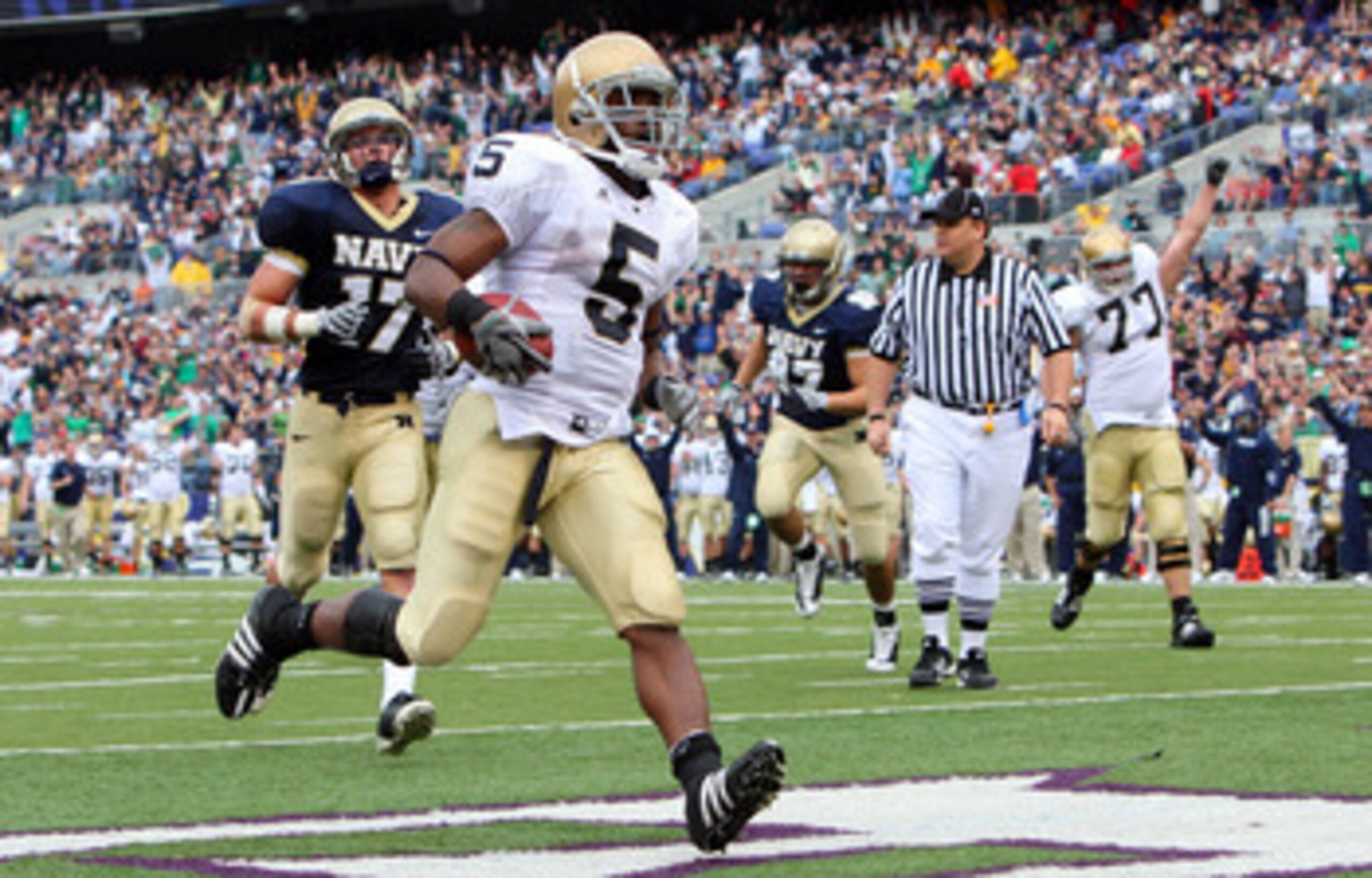 BALTIMORE - NOVEMBER 15:  Allen Armando #5 of the Notre Dame Fighting Irish runs in a third quarter touchdown against the Navy Midshipmen on November 15, 2008 at M&T Bank Stadium in Baltimore, Maryland. Notre Dame defeated Navy 27-21.  (Photo by Jim McIsa