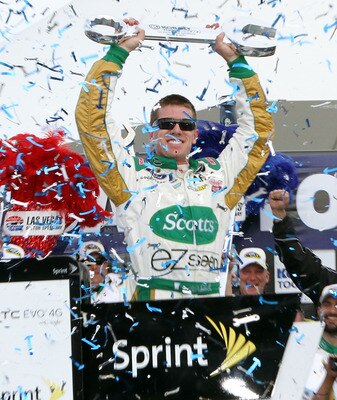LAS VEGAS, NV - MARCH 06:  Carl Edwards, driver of the #99 Scotts/Kellogg's Ford, celebrates in Victory Lane after winning the NASCAR Sprint Cup Series Kobalt Tools 400 at Las Vegas Motor Speedway on March 6, 2011 in Las Vegas, Nevada.  (Photo by Jerry Ma