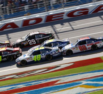 TALLADEGA, AL - APRIL 17:  Clint Bowyer, driver of the #33 BB&T Chevrolet, Jeff Gordon, driver of the #24 Drive to End Hunger/AARP Chevrolet, and Jimmie Johnson, driver of the #48 Lowe's Chevrolet, lead Kevin Harvick, driver of the #29 Budweiser Chevrolet