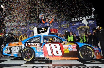 RICHMOND, VA - APRIL 30:  Kyle Busch, driver of the #18 M&M's Pretzel Toyota, celebrates in victory lane after winning the NASCAR Sprint Cup Series Crown Royal Presents The Matthew & Daniel Hansen 400 at Richmond International Raceway on April 30, 2011 in