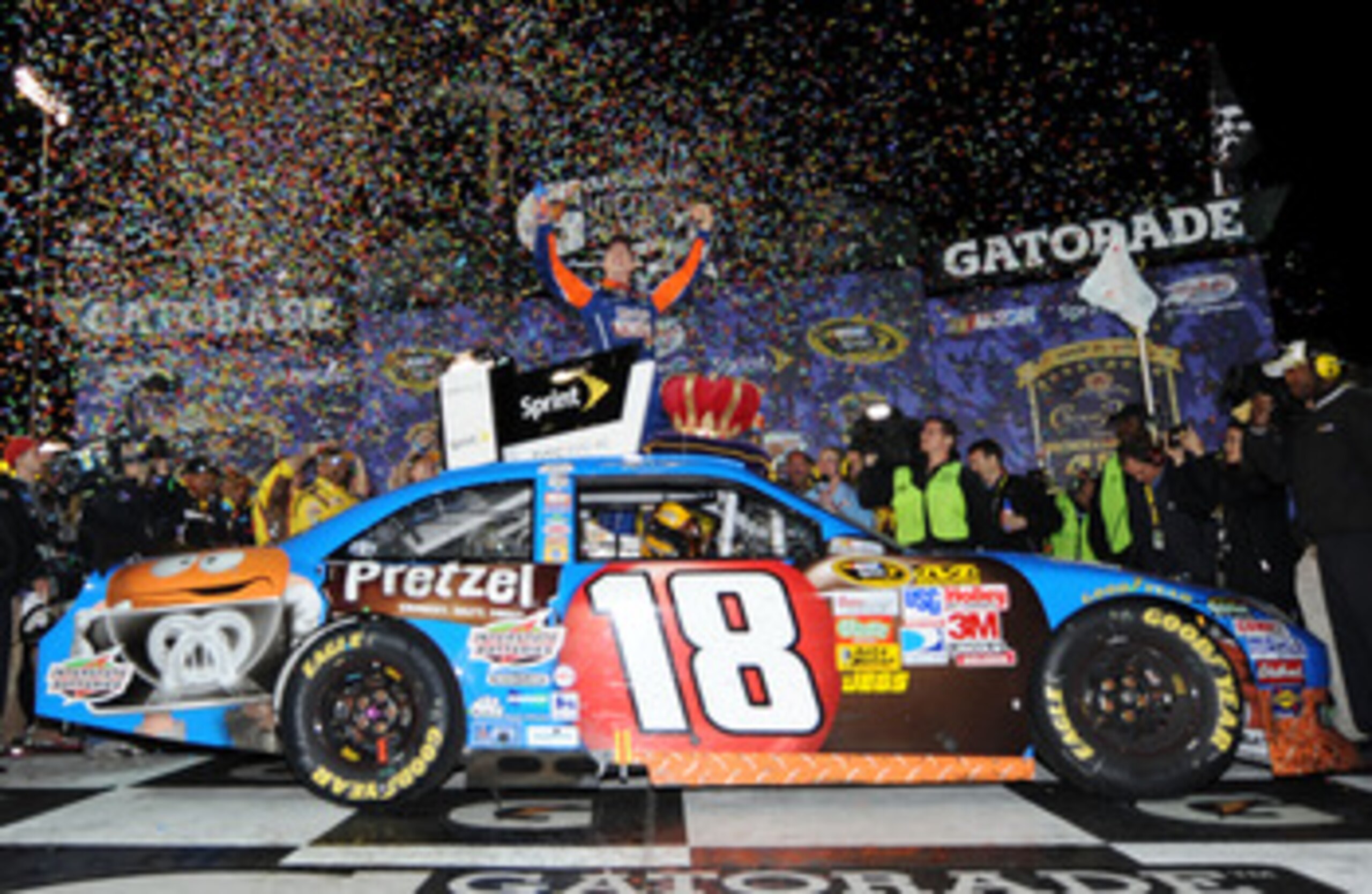 RICHMOND, VA - APRIL 30:  Kyle Busch, driver of the #18 M&M's Pretzel Toyota, celebrates in victory lane after winning the NASCAR Sprint Cup Series Crown Royal Presents The Matthew & Daniel Hansen 400 at Richmond International Raceway on April 30, 2011 in
