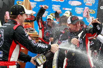 FONTANA, CA - MARCH 27:  (L and R) Kevin Harvick, driver of the #29 Jimmy John's Chevrolet, and crew chief Gil Martin celebrate in victory lane after winning the NASCAR Sprint Cup Series Auto Club 400 at Auto Club Speedway on March 27, 2011 in Fontana, Ca