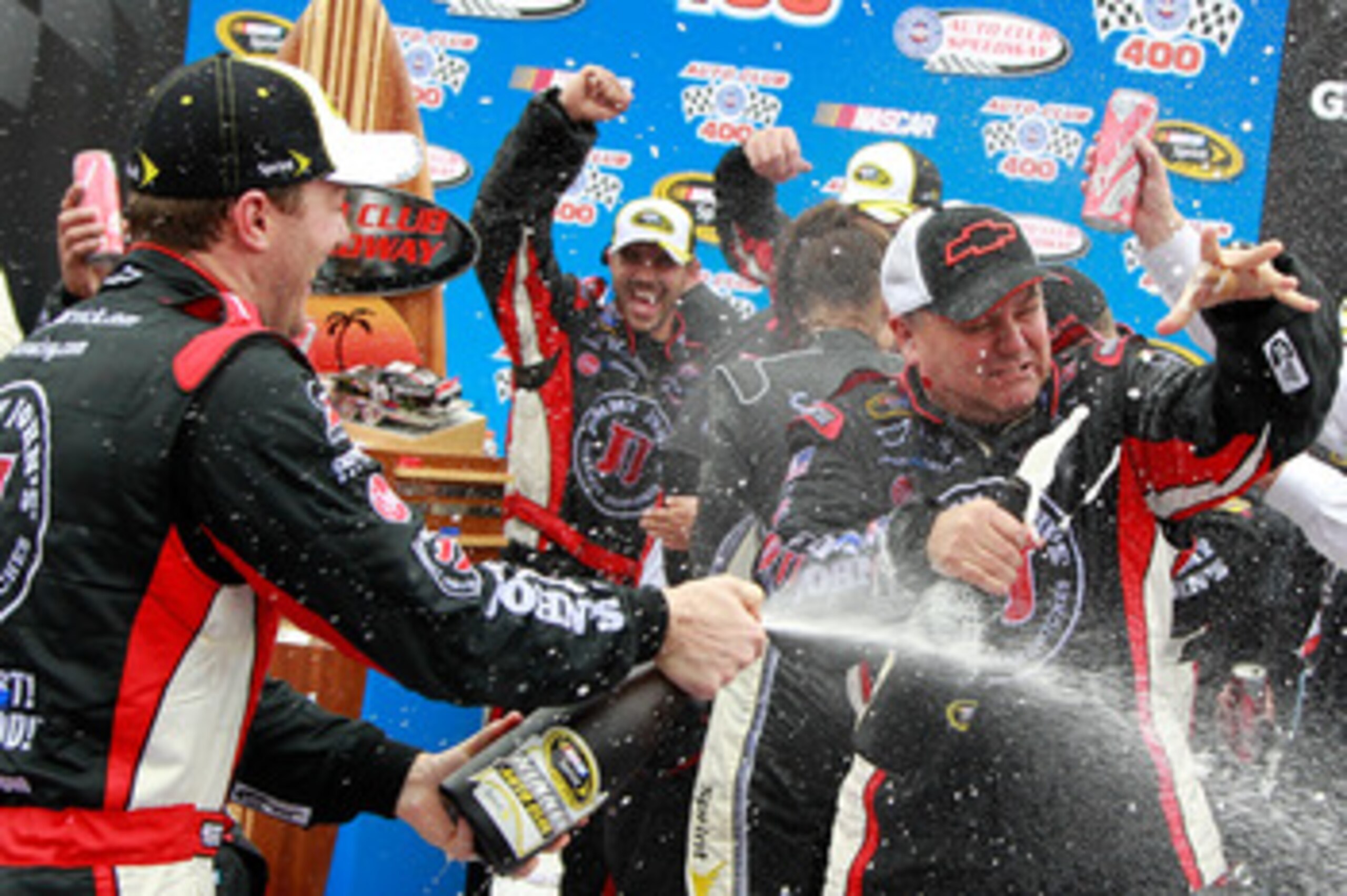 FONTANA, CA - MARCH 27:  (L and R) Kevin Harvick, driver of the #29 Jimmy John's Chevrolet, and crew chief Gil Martin celebrate in victory lane after winning the NASCAR Sprint Cup Series Auto Club 400 at Auto Club Speedway on March 27, 2011 in Fontana, Ca