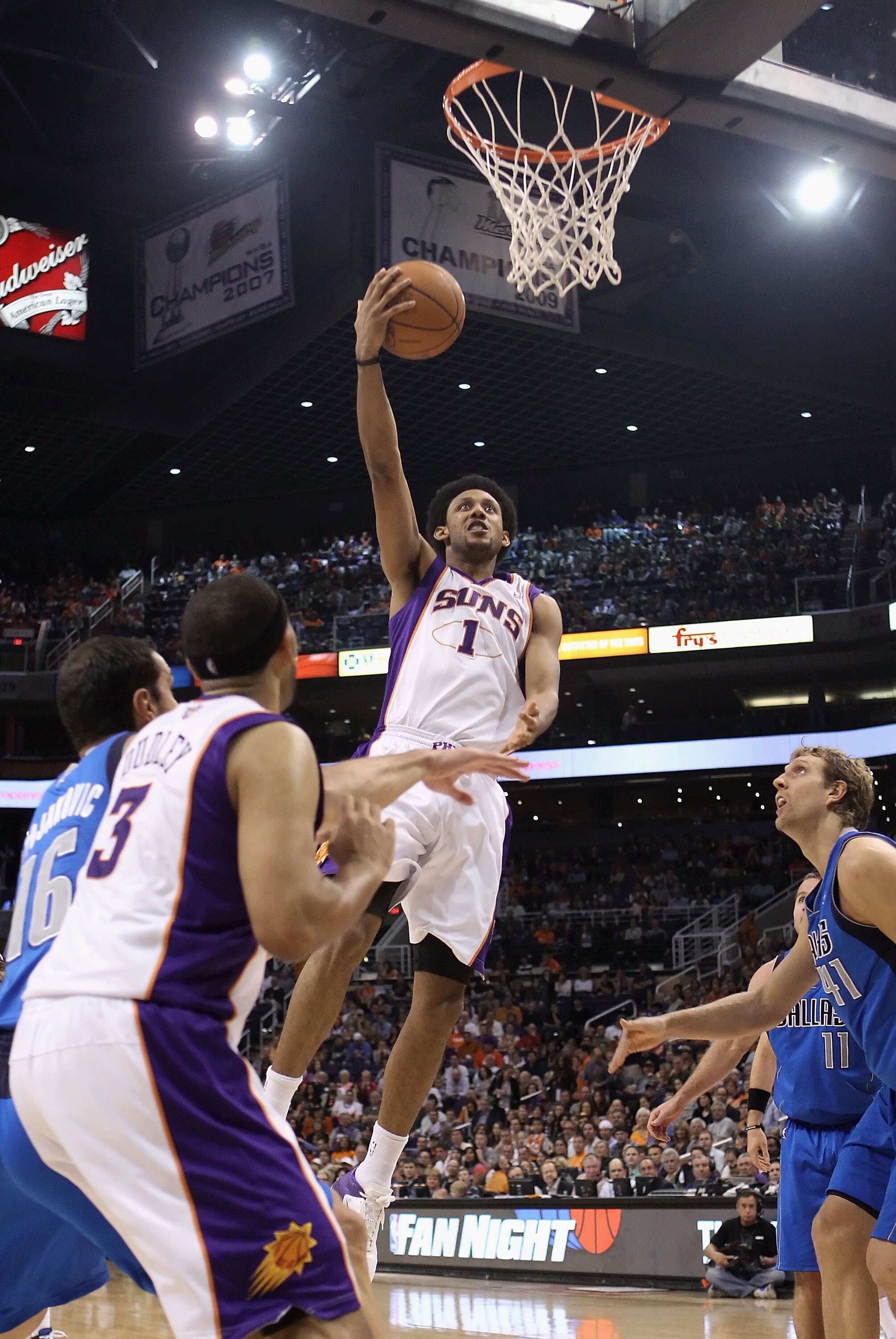PHOENIX, AZ - MARCH 27:  Josh Childress #1 of the Phoenix Suns lays up a shot against the Dallas Mavericks during the NBA game at US Airways Center on March 27, 2011 in Phoenix, Arizona.  The Mavericks defeated the Suns 91-83.  NOTE TO USER: User expressl