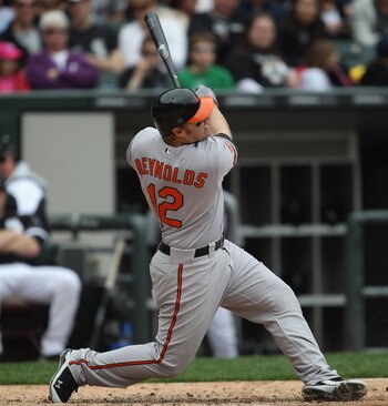 CHICAGO, IL - MAY 01: Mark Reynolds #12 of the Baltimore Orioles hits the ball against the Chicago White Sox at U.S. Cellular Field on May 1, 2011 in Chicago, Illinois. The Orioles defeated the White Sox 6-4. (Photo by Jonathan Daniel/Getty Images)