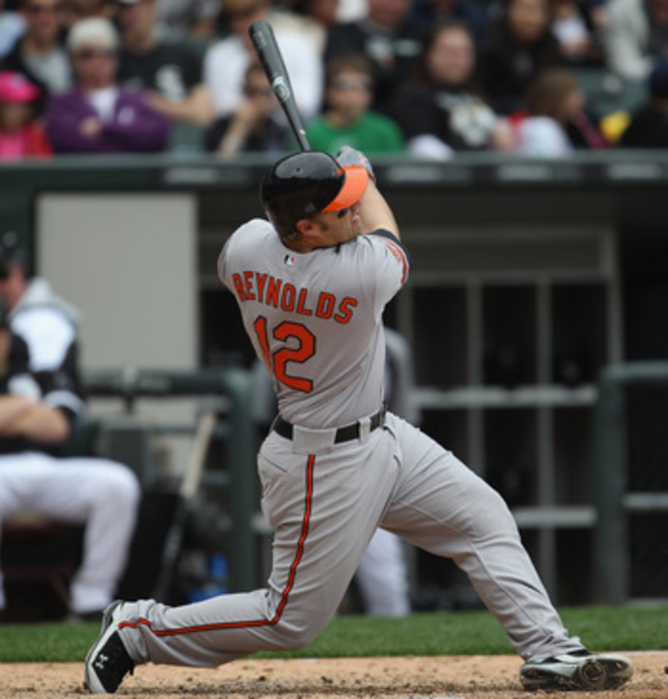 CHICAGO, IL - MAY 01: Mark Reynolds #12 of the Baltimore Orioles hits the ball against the Chicago White Sox at U.S. Cellular Field on May 1, 2011 in Chicago, Illinois. The Orioles defeated the White Sox 6-4. (Photo by Jonathan Daniel/Getty Images)