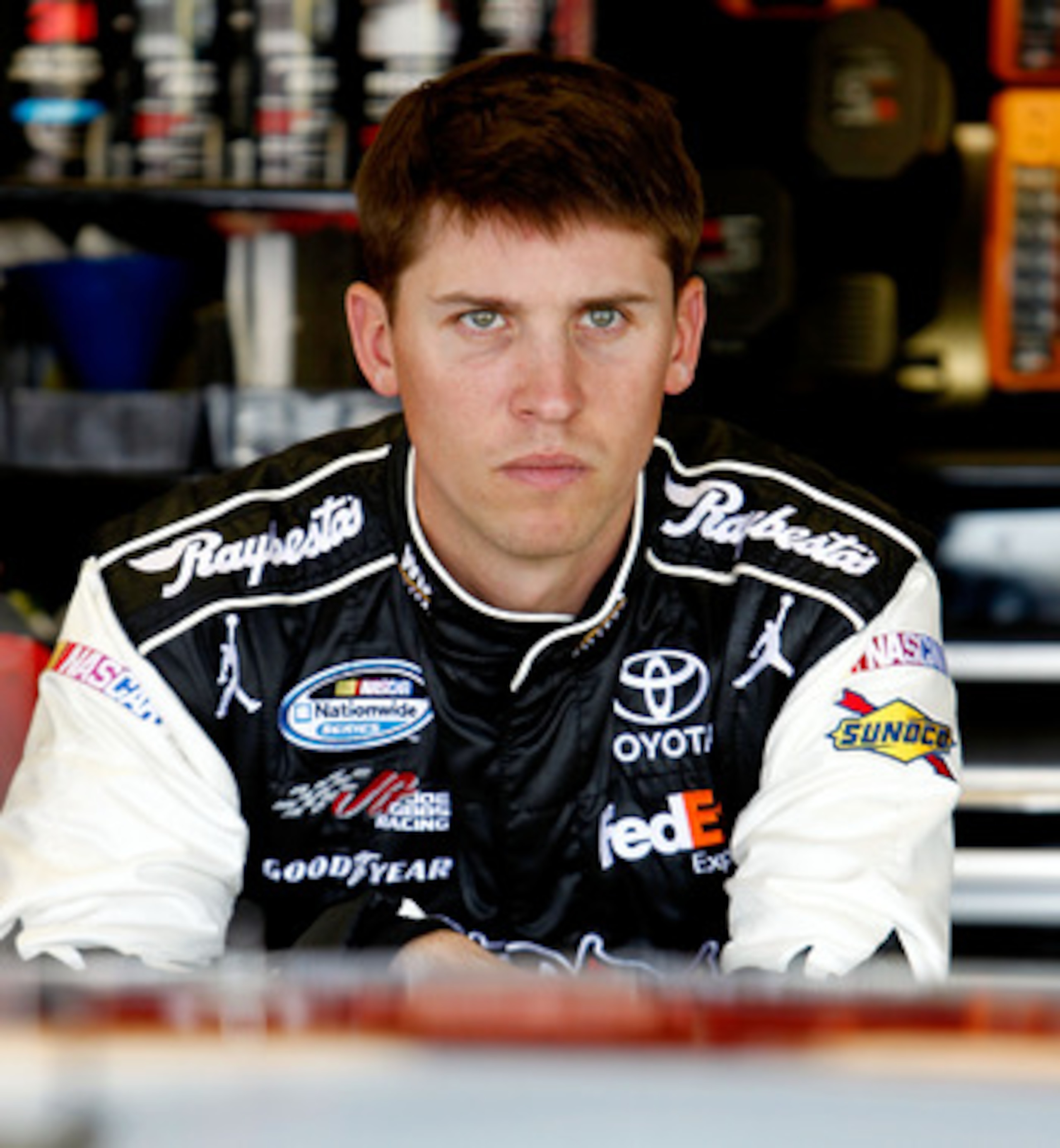 DARLINGTON, SC - MAY 06:  Denny Hamlin, driver of the #11 Sport Clips Toyota, stands in the garage during practice for the NASCAR Sprint Cup Series SHOWTIME Southern 500 at Darlington Raceway on May 6, 2011 in Darlington, South Carolina.  (Photo by Jeff Z