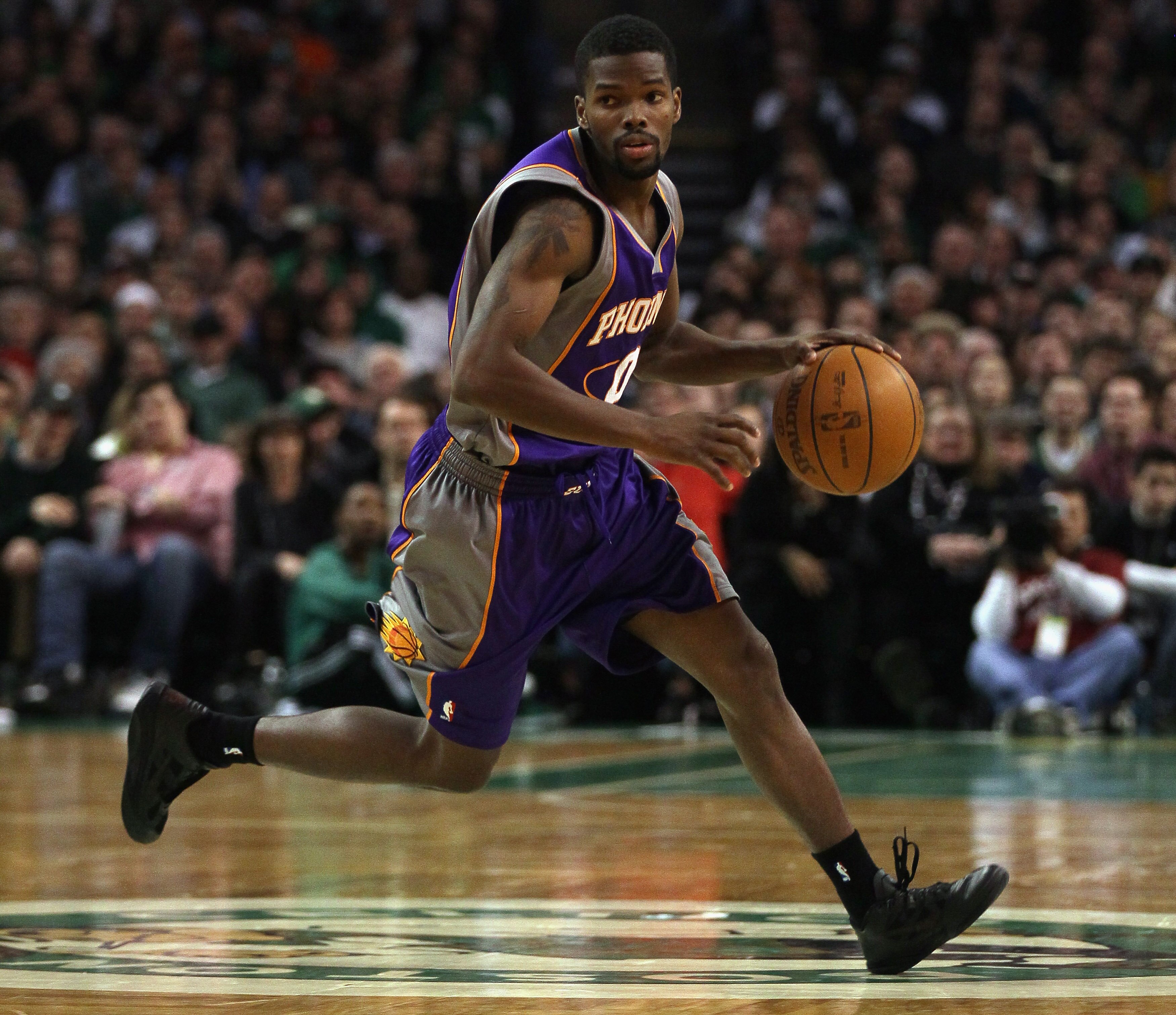 BOSTON, MA - MARCH 02:  Aaron Brooks #0 of the Phoenix Suns heads up the court in the second half against the Boston Celtics on March 2, 2011 at the TD Garden in Boston, Massachusetts.  The Celtics defeated the Suns 115-103. NOTE TO USER: User expressly a