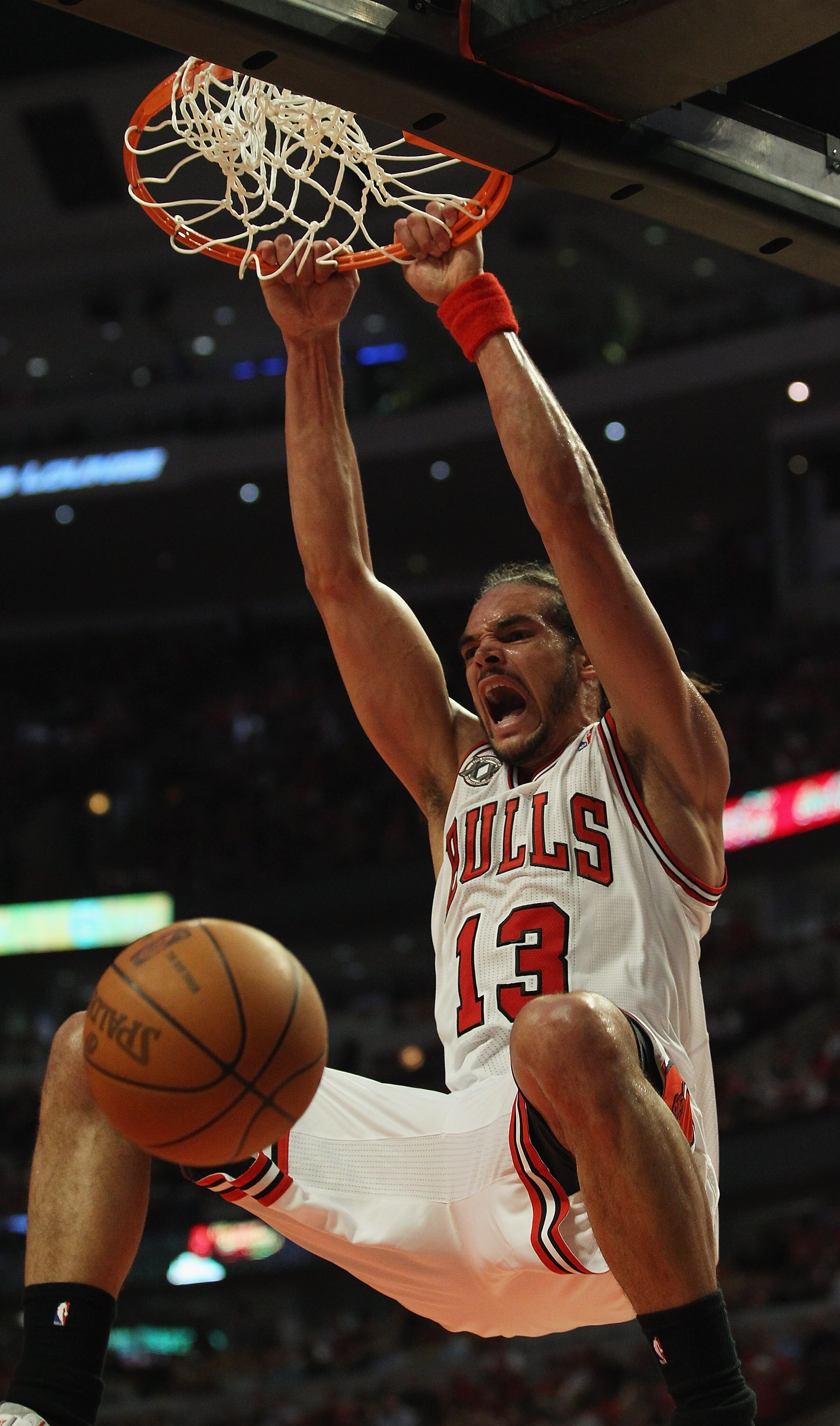 CHICAGO, IL - MAY 02: Joakim Noah #13 of the Chicago Bulls dunks the ball against the Atlanta Hawks in Game One of the Eastern Conference Semifinals in the 2011 NBA Playoffs at the United Center on May 2, 2011 in Chicago, Illinois. The Hawks defeated the