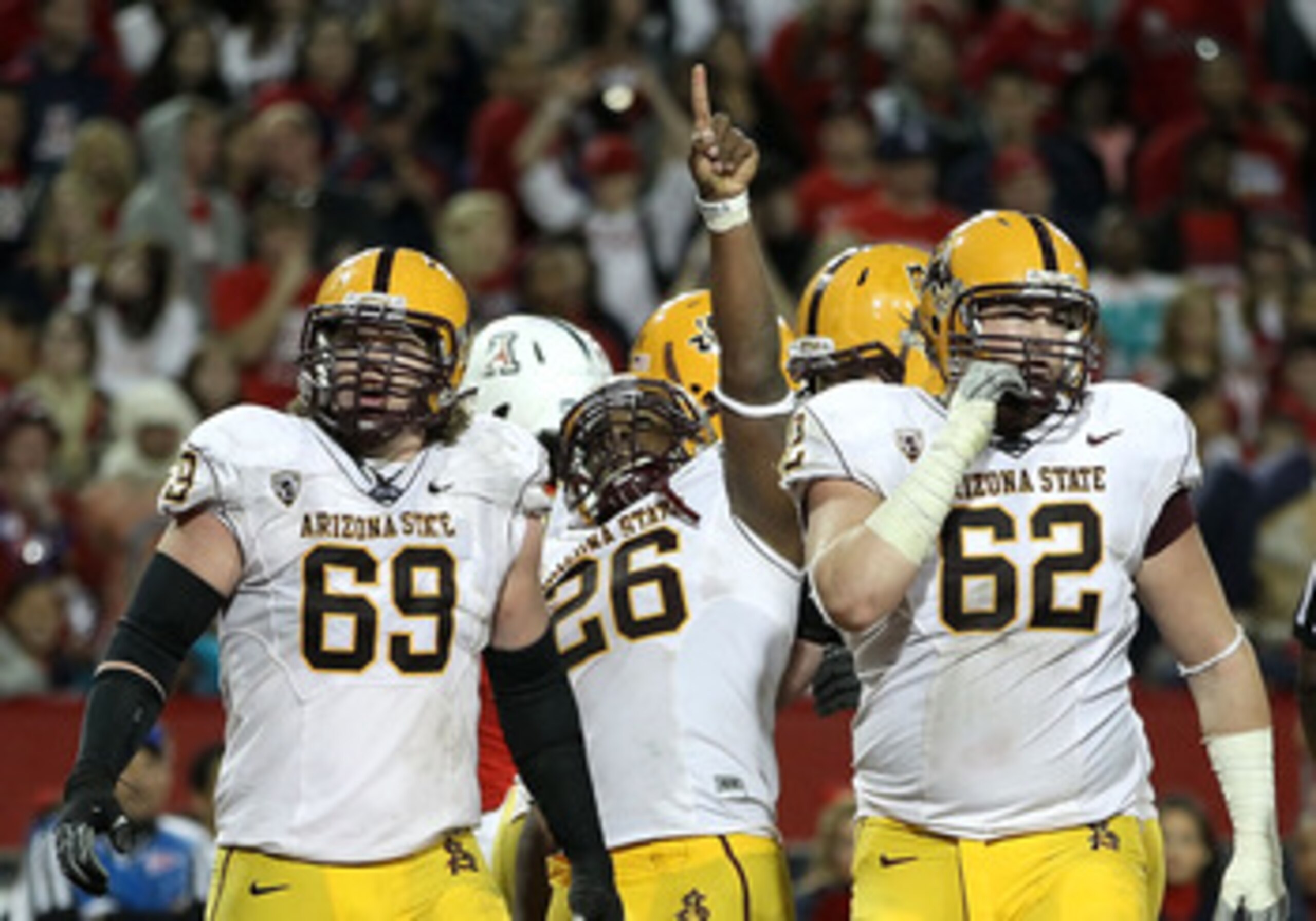 TUCSON, AZ - DECEMBER 02: Runningback Cameron Marshall #26 of the Arizona State Sun Devils celebrates after scoring a 2 yard rushing touchdown against the Arizona Wildcats during the double overtime of the college football game at Arizona Stadium on Dece TUCSON, AZ - DECEMBER 02: Runningback Cameron Marshall #26 of the Arizona State Sun Devils celebrates after scoring a 2 yard rushing touchdown against the Arizona Wildcats during the double overtime of the college football game at Arizona Stadium on Dece