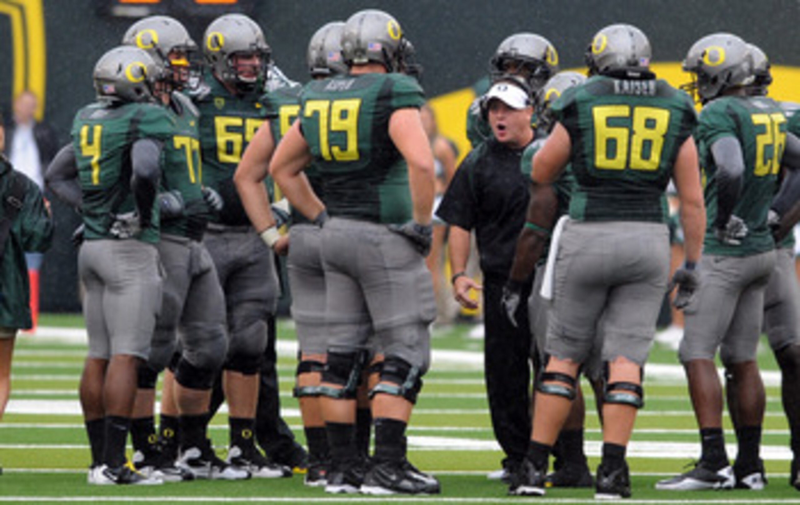 EUGENE, OR - SEPTEMBER 18: Head coach Chip Kelly of the Oregon Ducks has some words with his offensive unit during a time out in the second quarter of the game against the Portland State Vikings at Autzen Stadium on September 18, 2010 in Eugene, Oregon. EUGENE, OR - SEPTEMBER 18: Head coach Chip Kelly of the Oregon Ducks has some words with his offensive unit during a time out in the second quarter of the game against the Portland State Vikings at Autzen Stadium on September 18, 2010 in Eugene, Oregon.