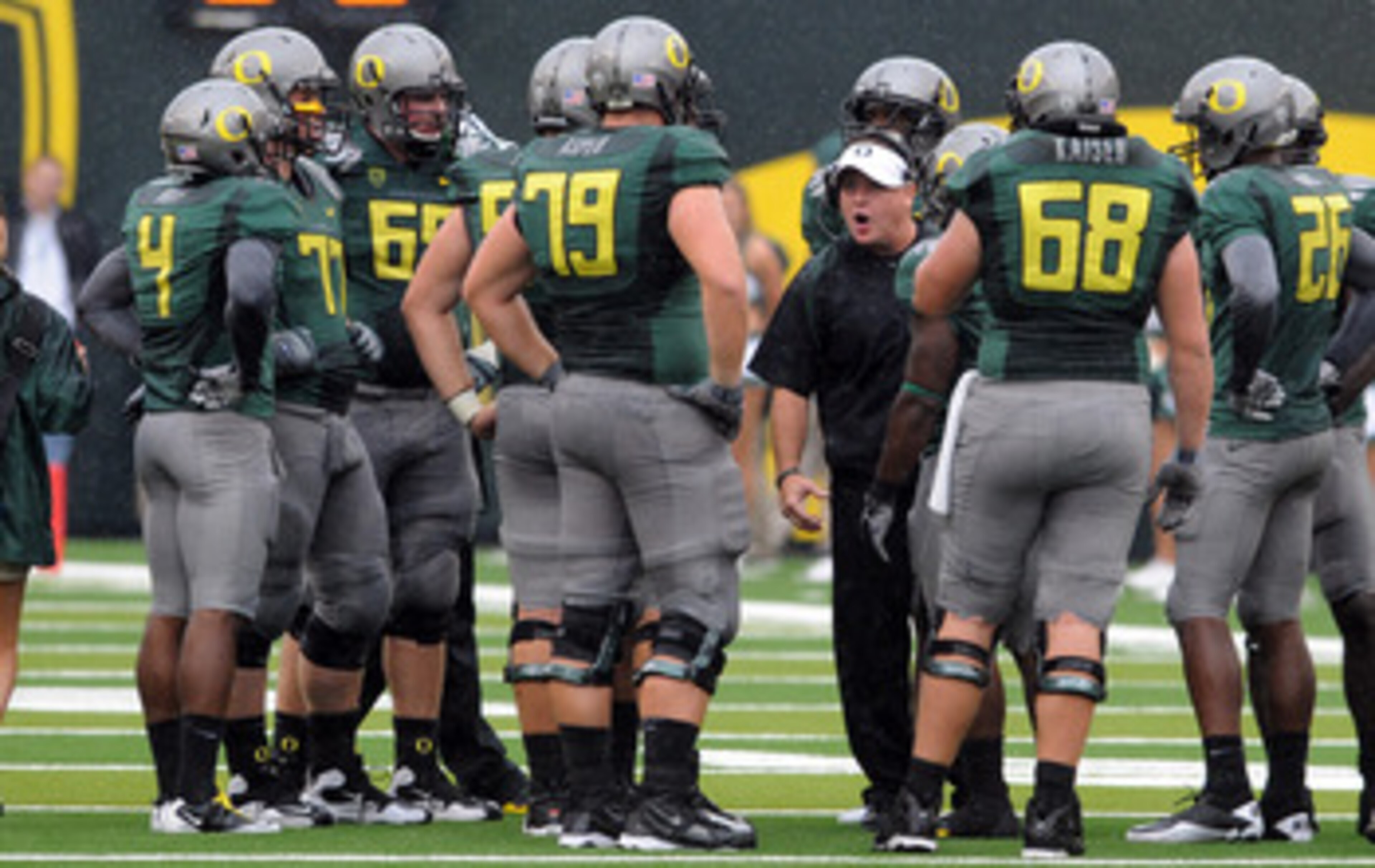 EUGENE, OR - SEPTEMBER 18: Head coach Chip Kelly of the Oregon Ducks has some words with his offensive unit during a time out in the second quarter of the game against the Portland State Vikings at Autzen Stadium on September 18, 2010 in Eugene, Oregon.