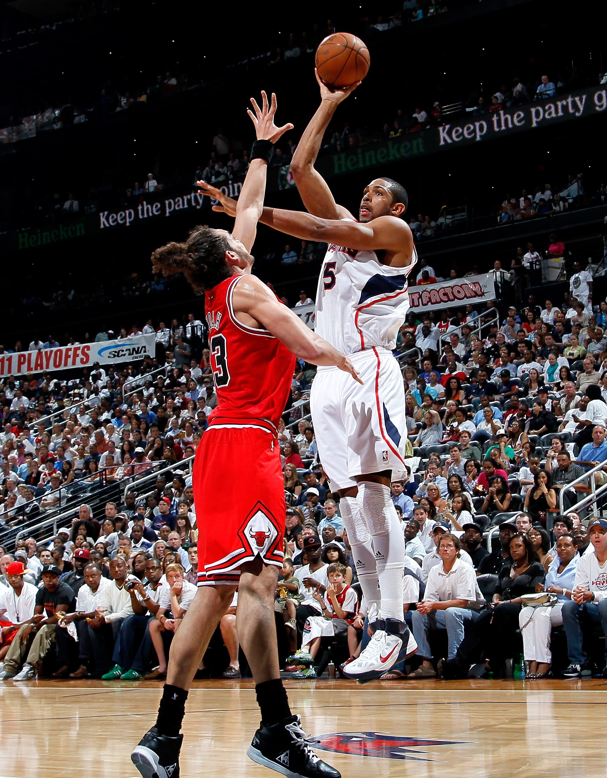 ATLANTA, GA - MAY 08:  Al Horford #15 of the Atlanta Hawks shoots against Joakim Noah #13 of the Chicago Bulls in Game Four of the Eastern Conference Semifinals in the 2011 NBA Playoffs at Phillips Arena on May 8, 2011 in Atlanta, Georgia.  NOTE TO USER: