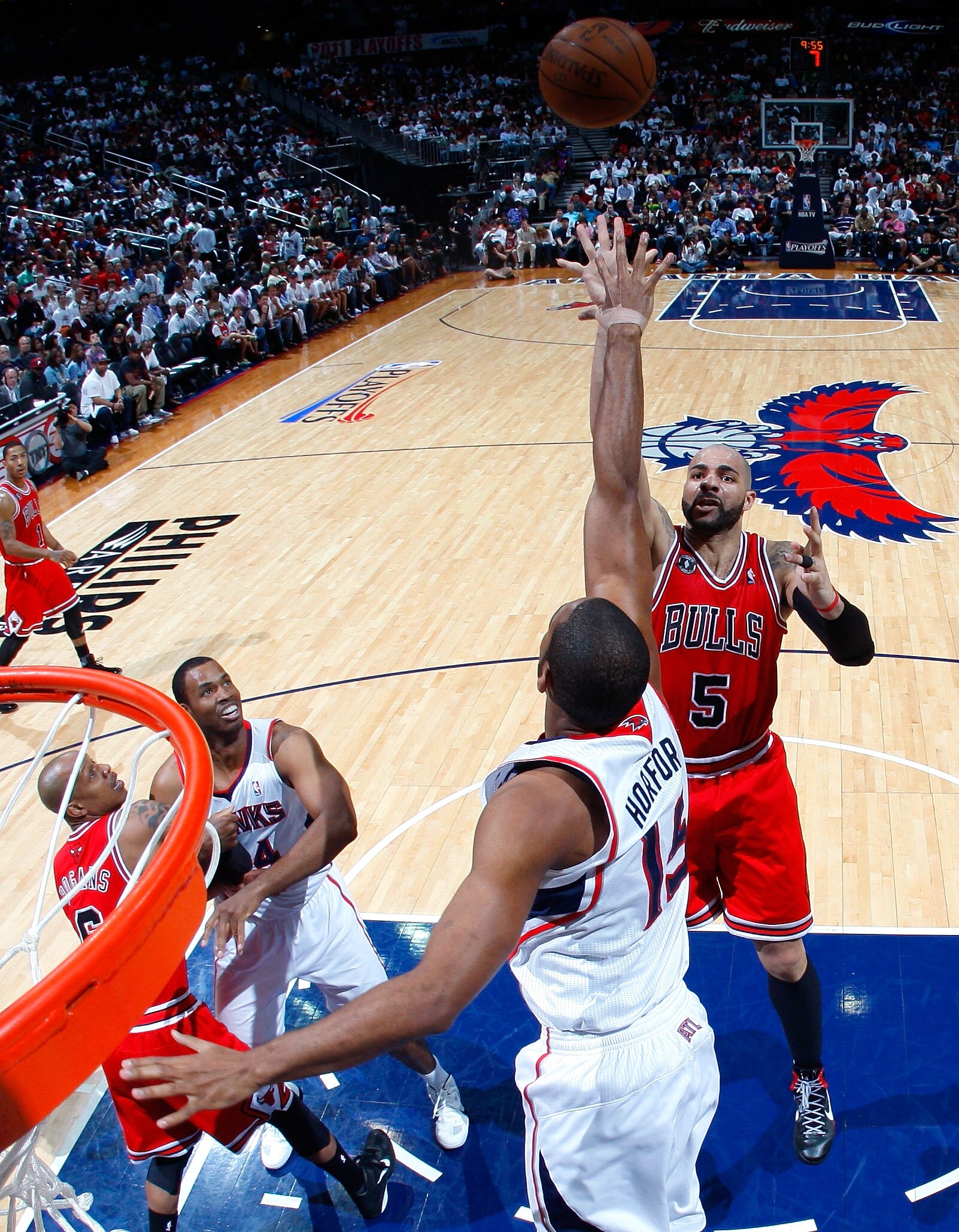 ATLANTA, GA - MAY 08:  Carlos Boozer #5 of the Chicago Bulls shoots over Al Horford #15 of the Atlanta Hawks in Game Four of the Eastern Conference Semifinals in the 2011 NBA Playoffs at Phillips Arena on May 8, 2011 in Atlanta, Georgia.  NOTE TO USER: Us