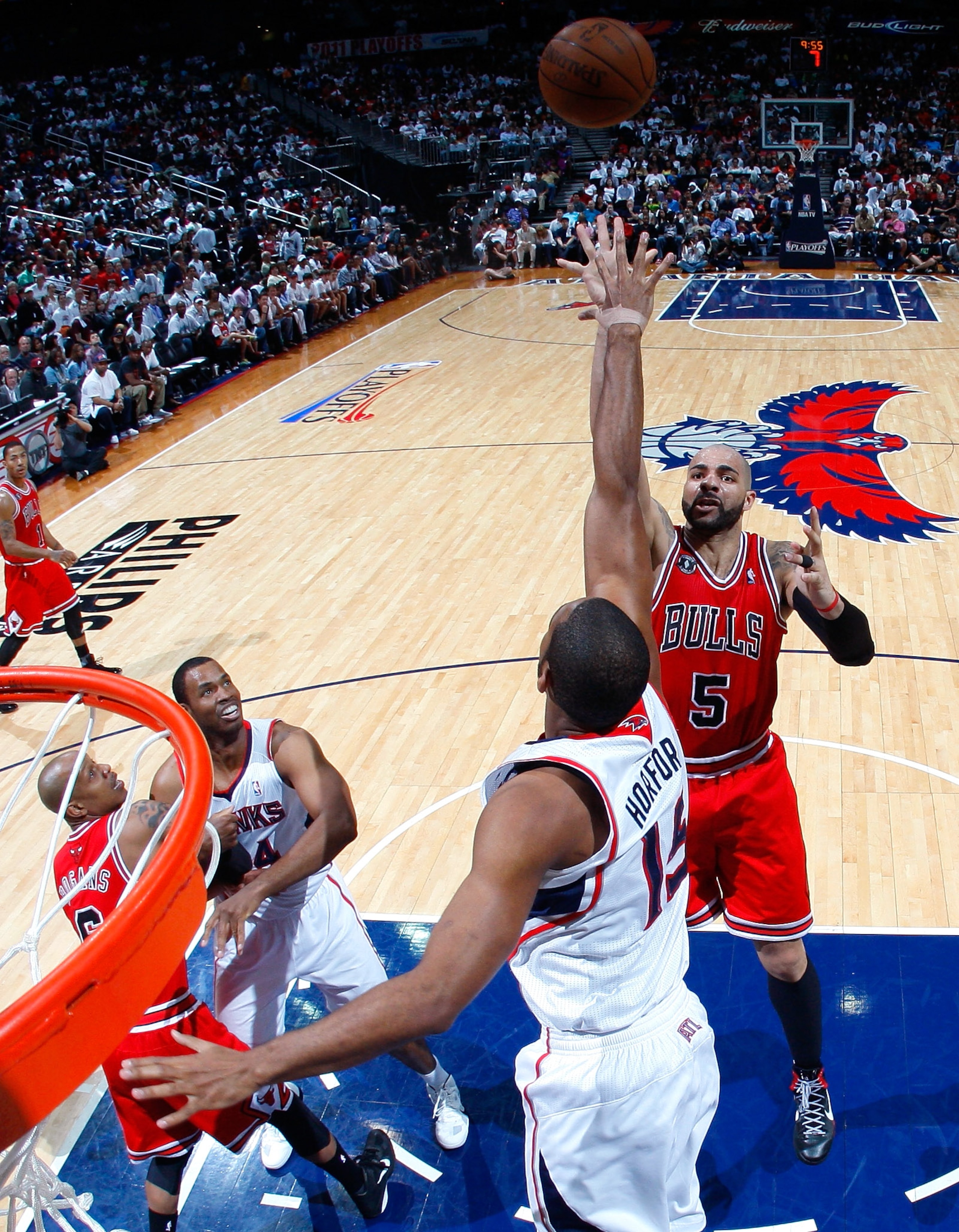 ATLANTA, GA - MAY 08:  Carlos Boozer #5 of the Chicago Bulls shoots over Al Horford #15 of the Atlanta Hawks in Game Four of the Eastern Conference Semifinals in the 2011 NBA Playoffs at Phillips Arena on May 8, 2011 in Atlanta, Georgia.  NOTE TO USER: Us