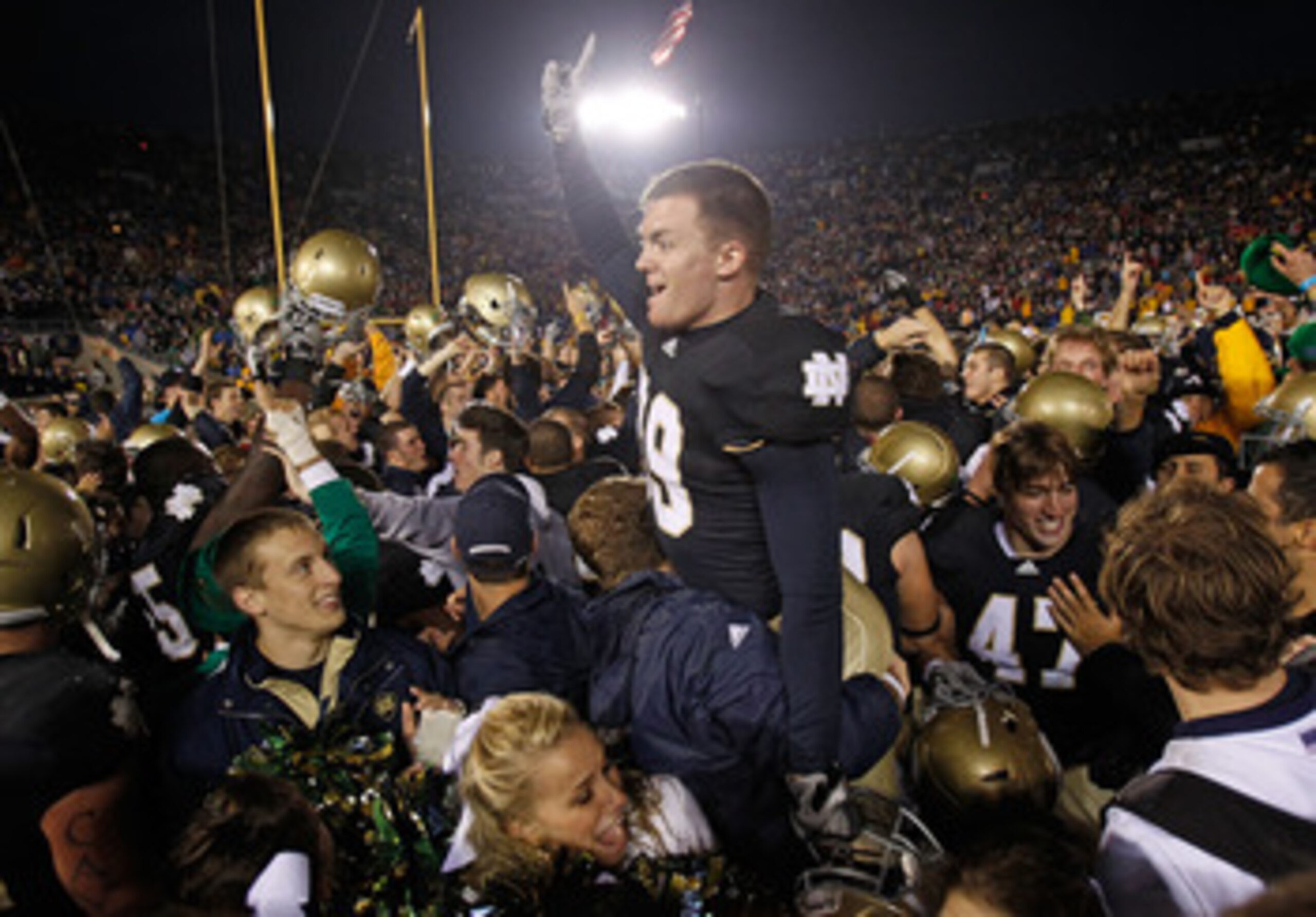SOUTH BEND, IN - NOVEMBER 13: Ryan Sheehan #39 of the Notre Dame Fighting Irish is lifted by students while celebrating a win over the Utah Utes at Notre Dame Stadium on November 13, 2010 in South Bend, Indiana. Notre Dame defeated Utah 28-3. (Photo by Jo