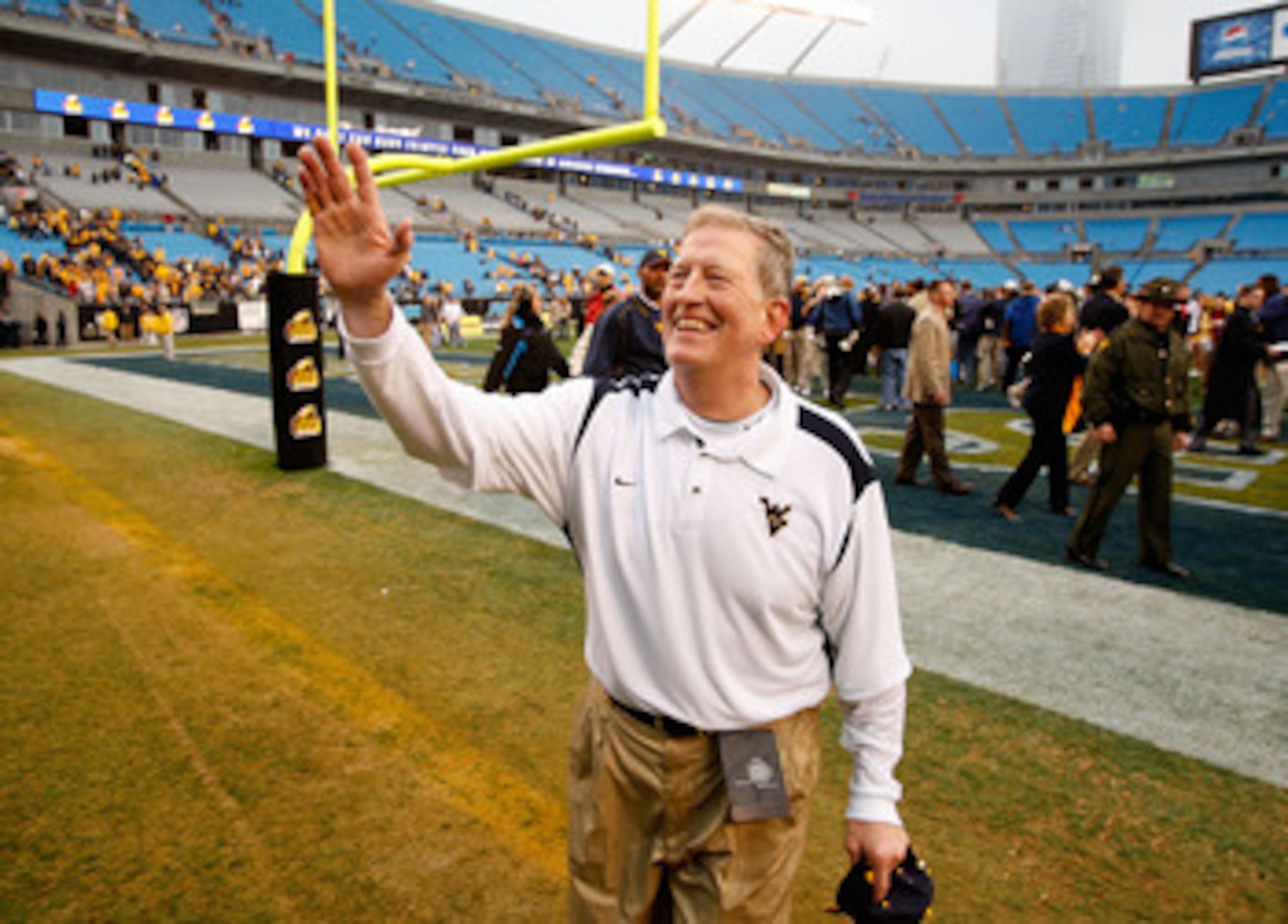 CHARLOTTE, NC - DECEMBER 27:  Head coach Bill Stewart of the West Virginia Mountaineers celebrates after a 31-30 victory over the North Carolina Tar Heels after the Meineke Car Care Bowl on December 27, 2008 at Bank of America Stadium in Charlotte, North